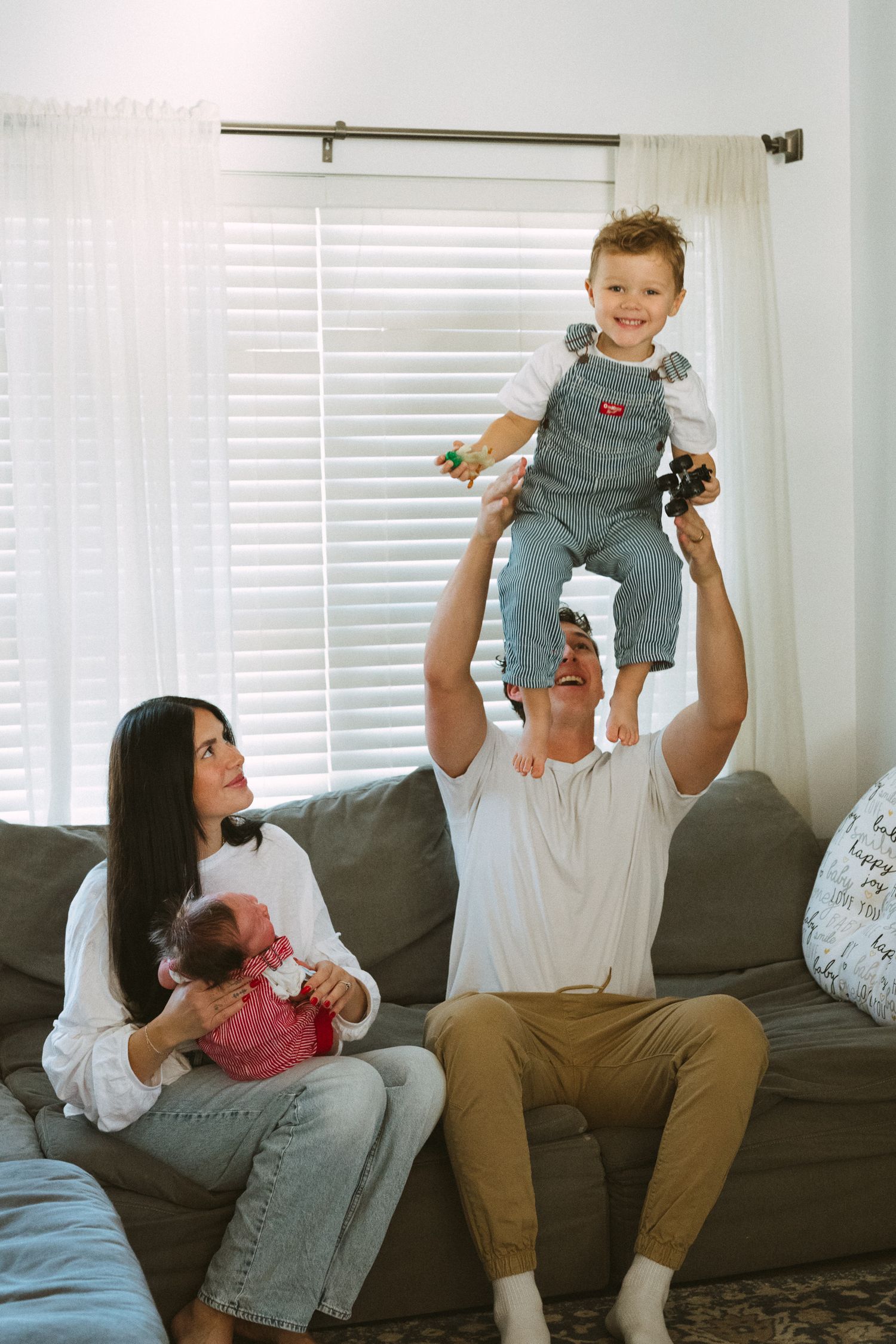A heartwarming series of three photos showing playful moments on a gray couch in a bright living room.