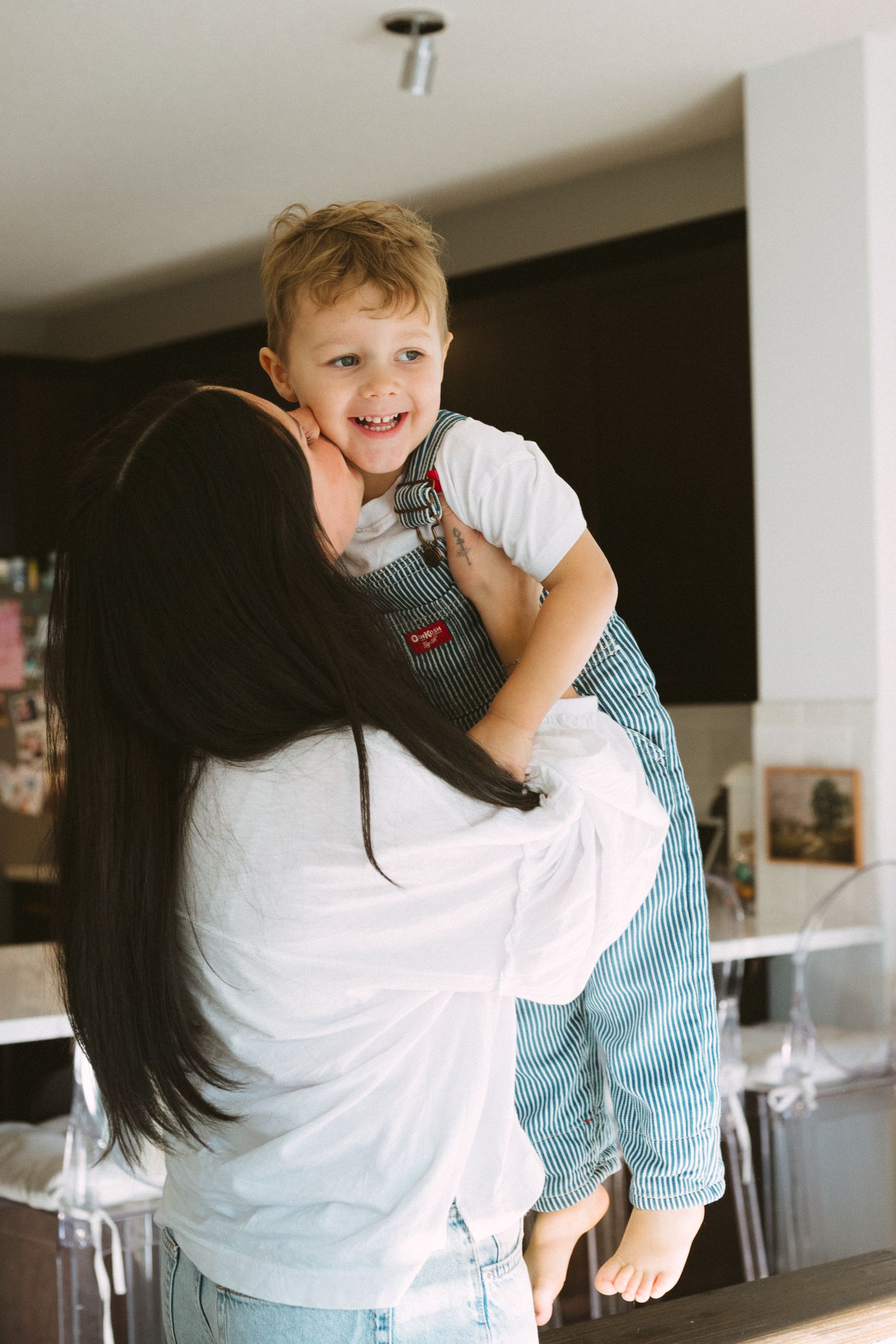 Playful moments captured in a series of candid photos showing joyful interactions in a bright indoor setting.