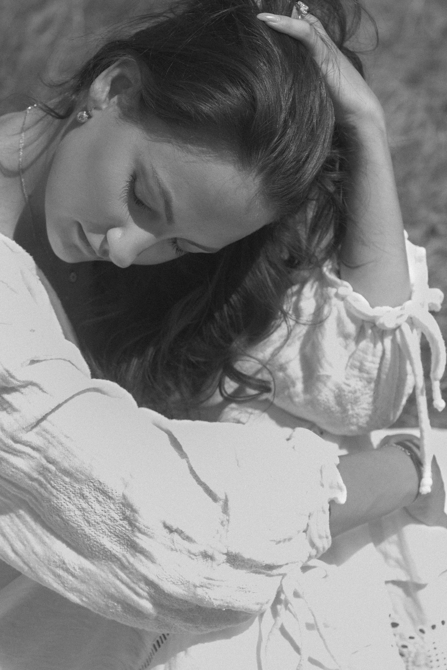 Black and white artistic portrait showing delicate details and textures.