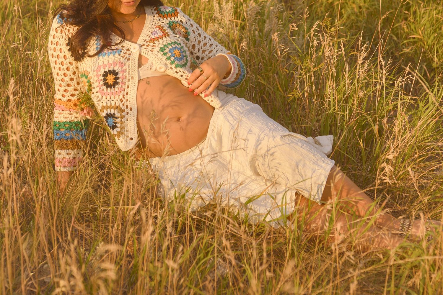 Bohemian style photography featuring delicate lace details against natural grass backdrop.