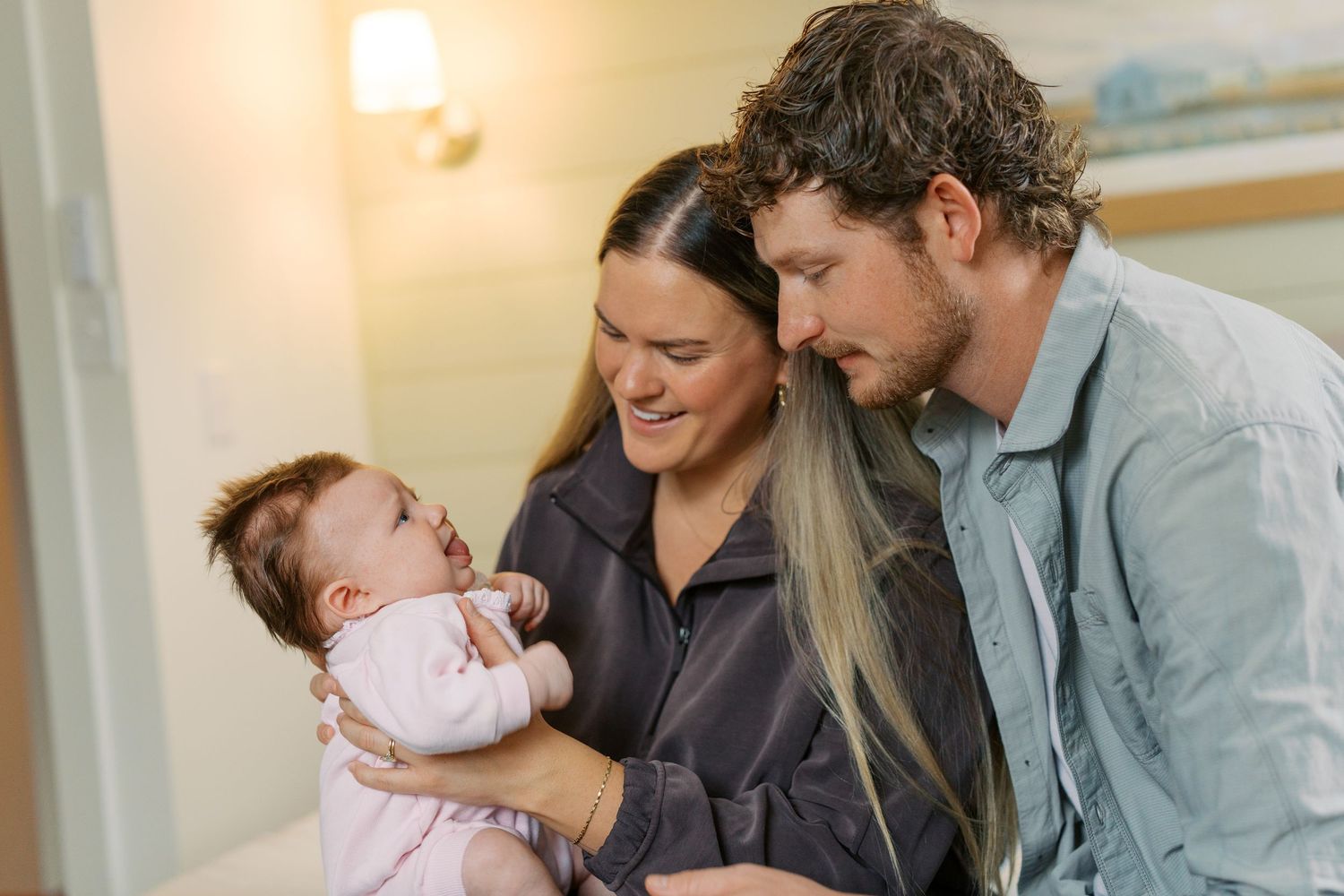 A series of tender family moments with a newborn in a warmly lit room.