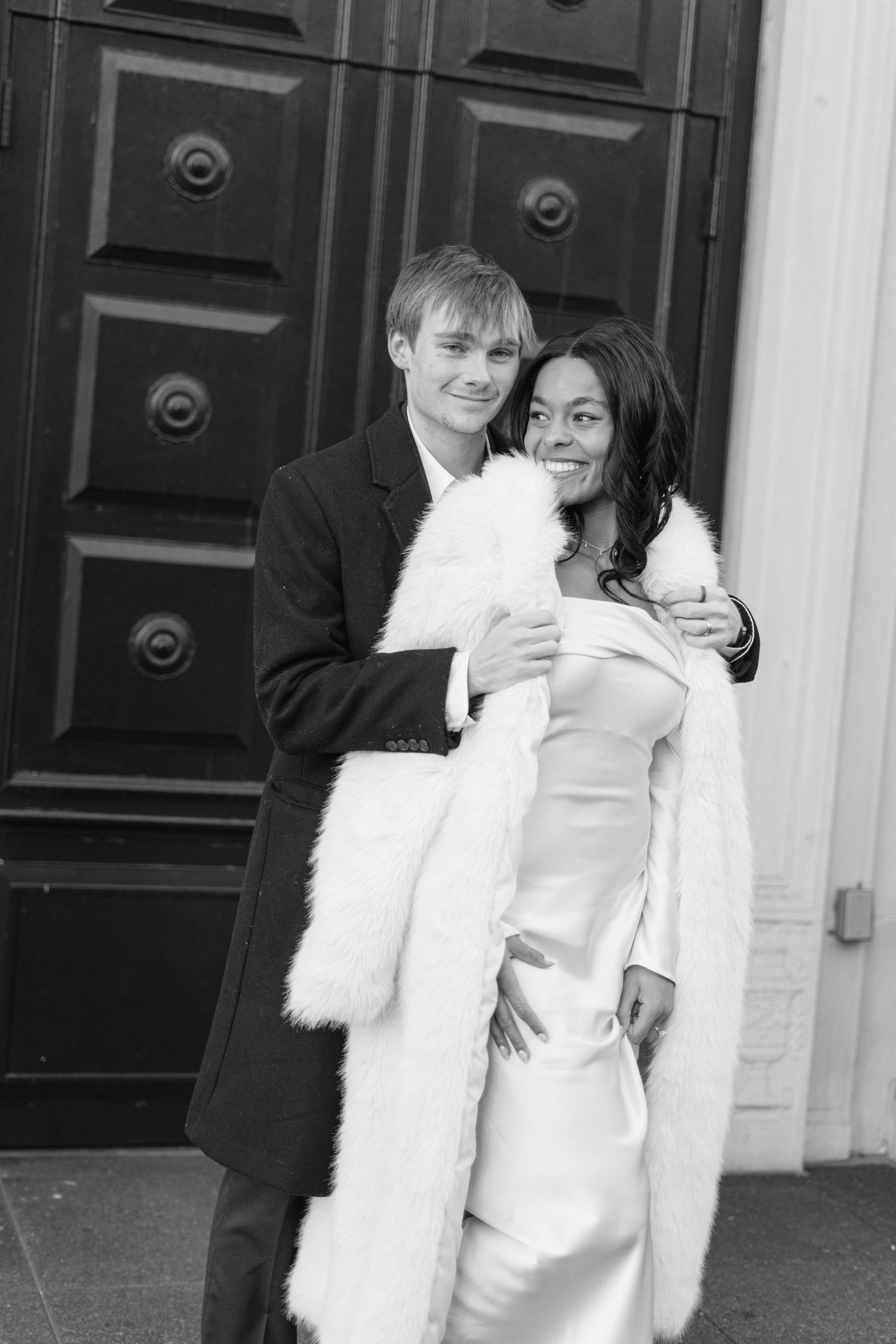 Black and white wedding portraits showing romantic embraces.