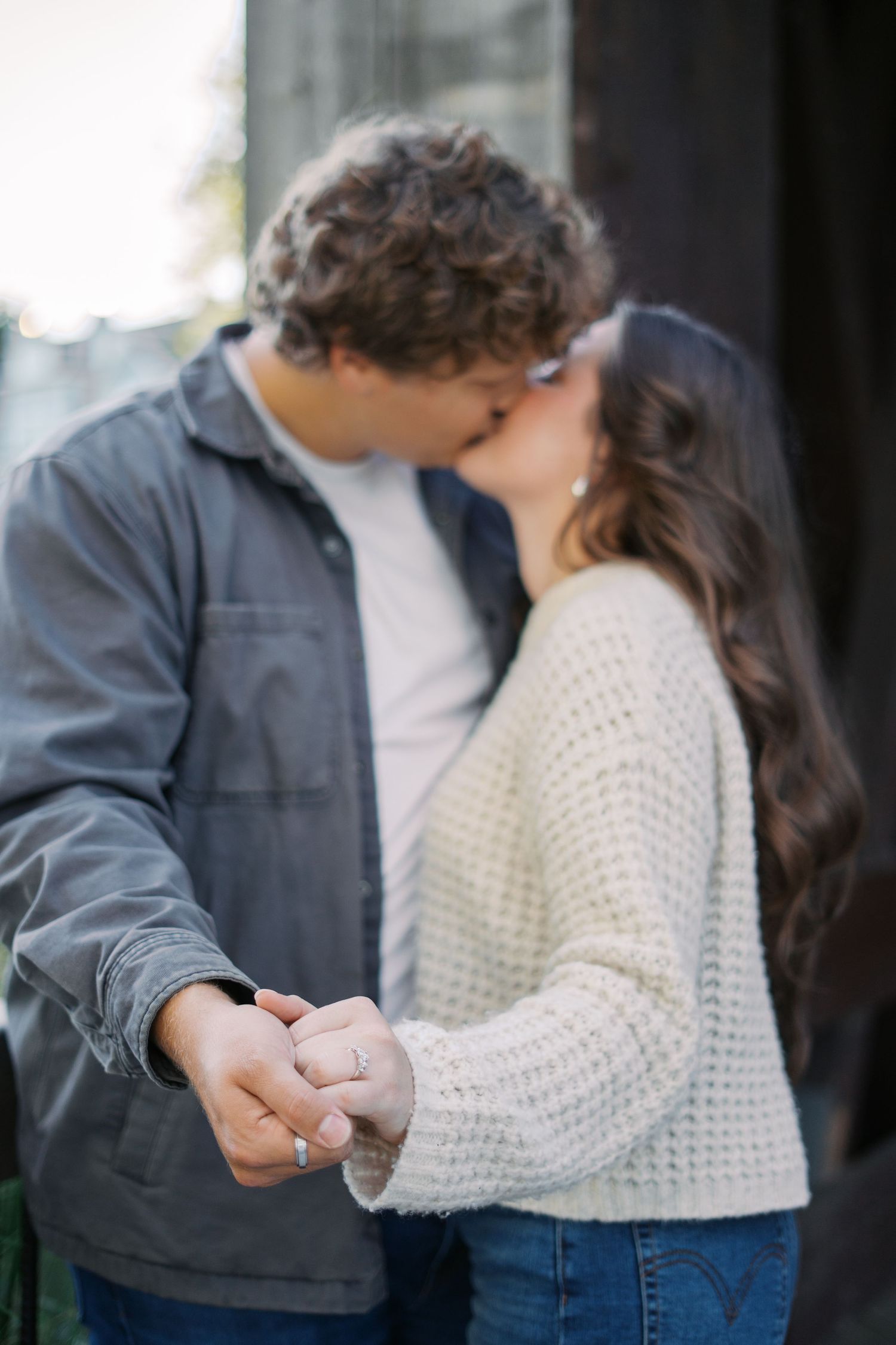 Couple in casual attire sharing an intimate moment.