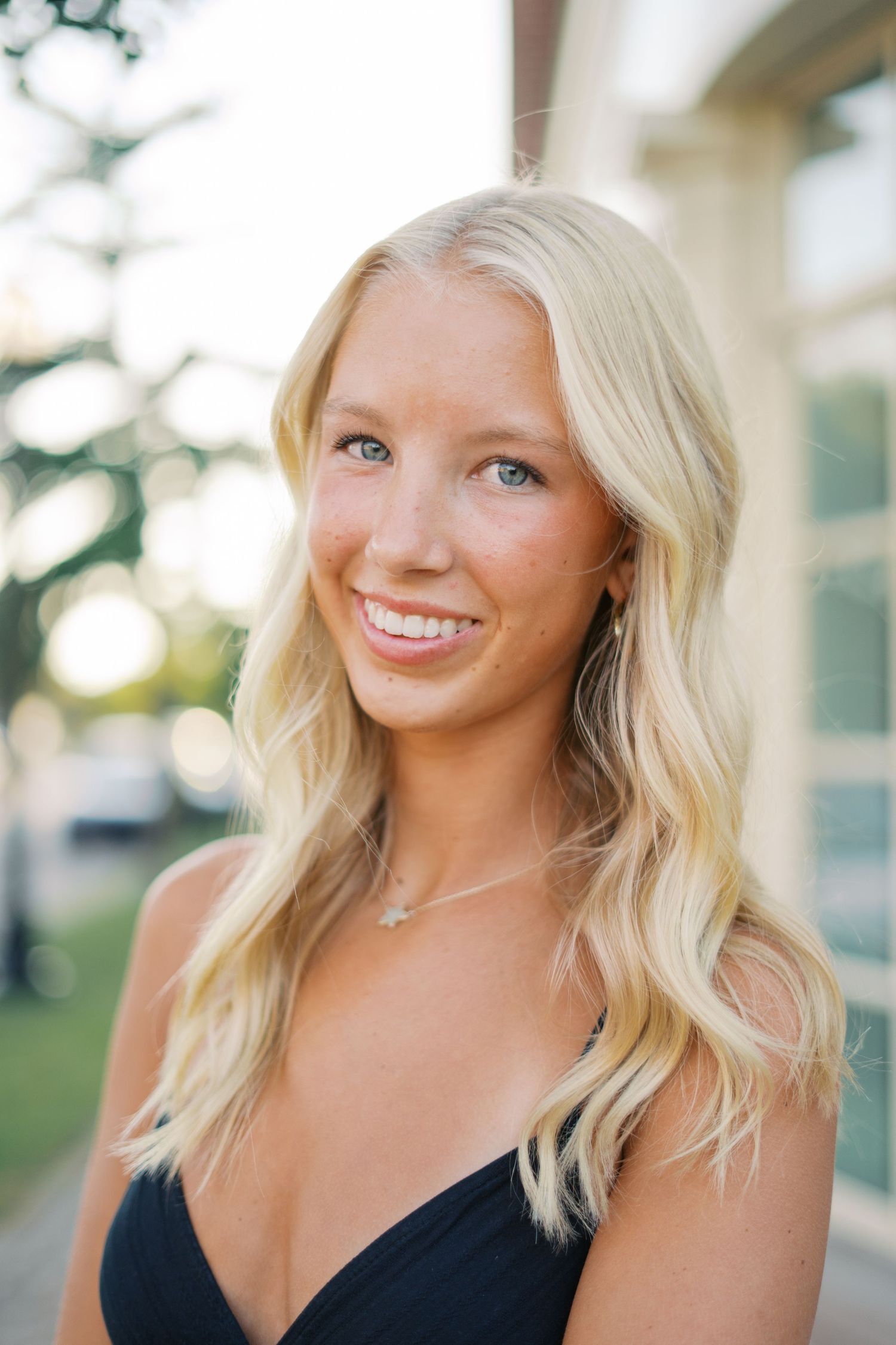 Portrait session outdoors with soft lighting and natural expressions.