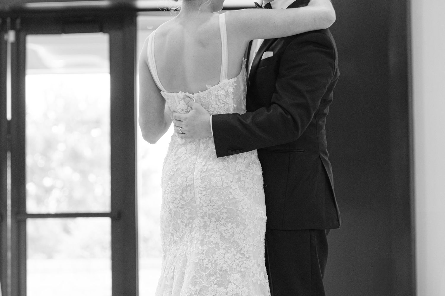 Intimate black and white portrait during wedding celebration.