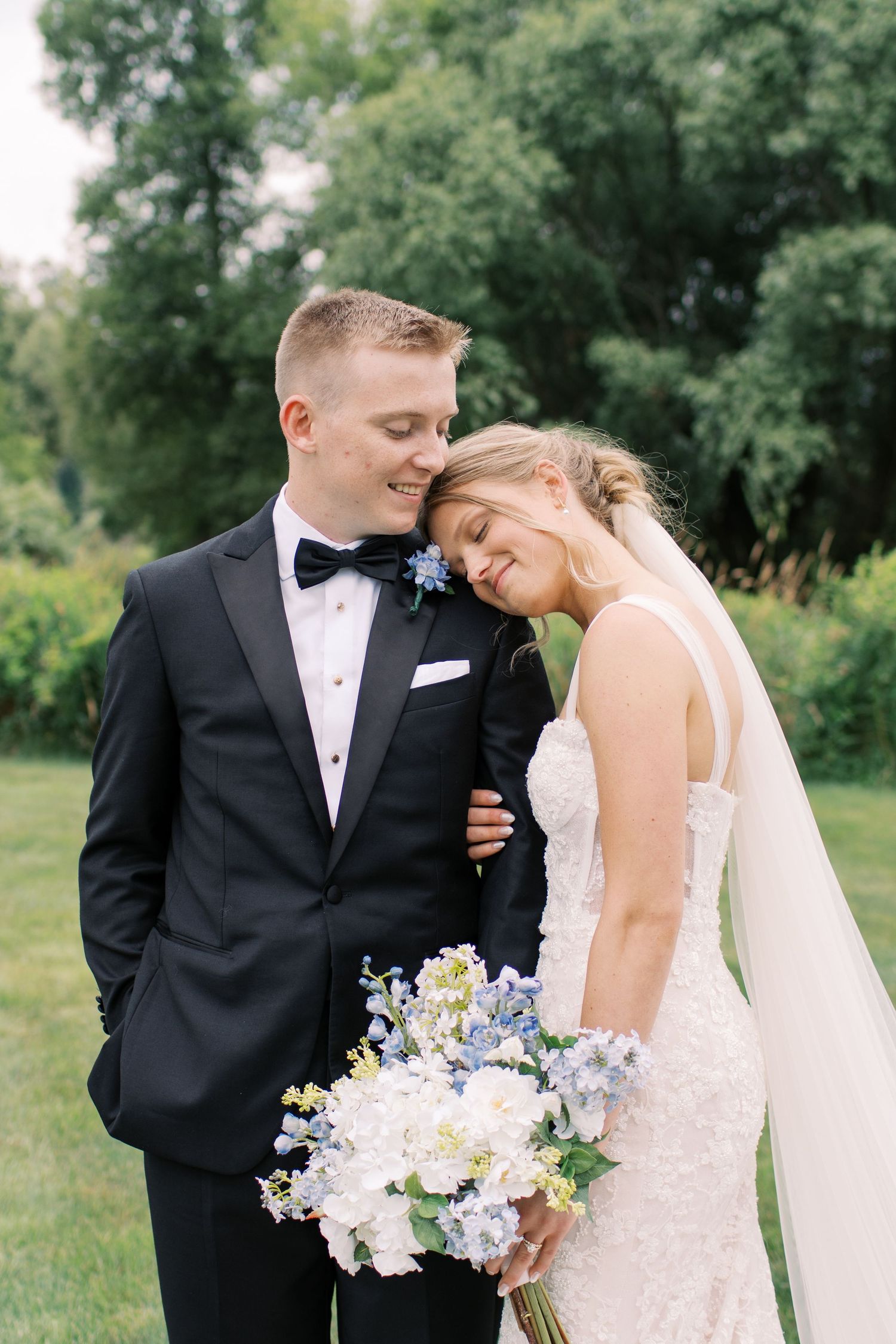 Tender wedding moments captured in a series of intimate poses outdoors with natural lighting.