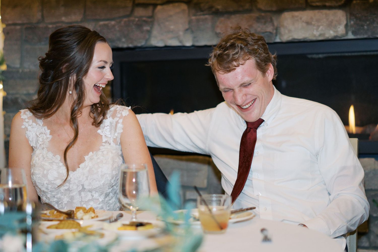 A couple shares a romantic moment during their wedding reception.