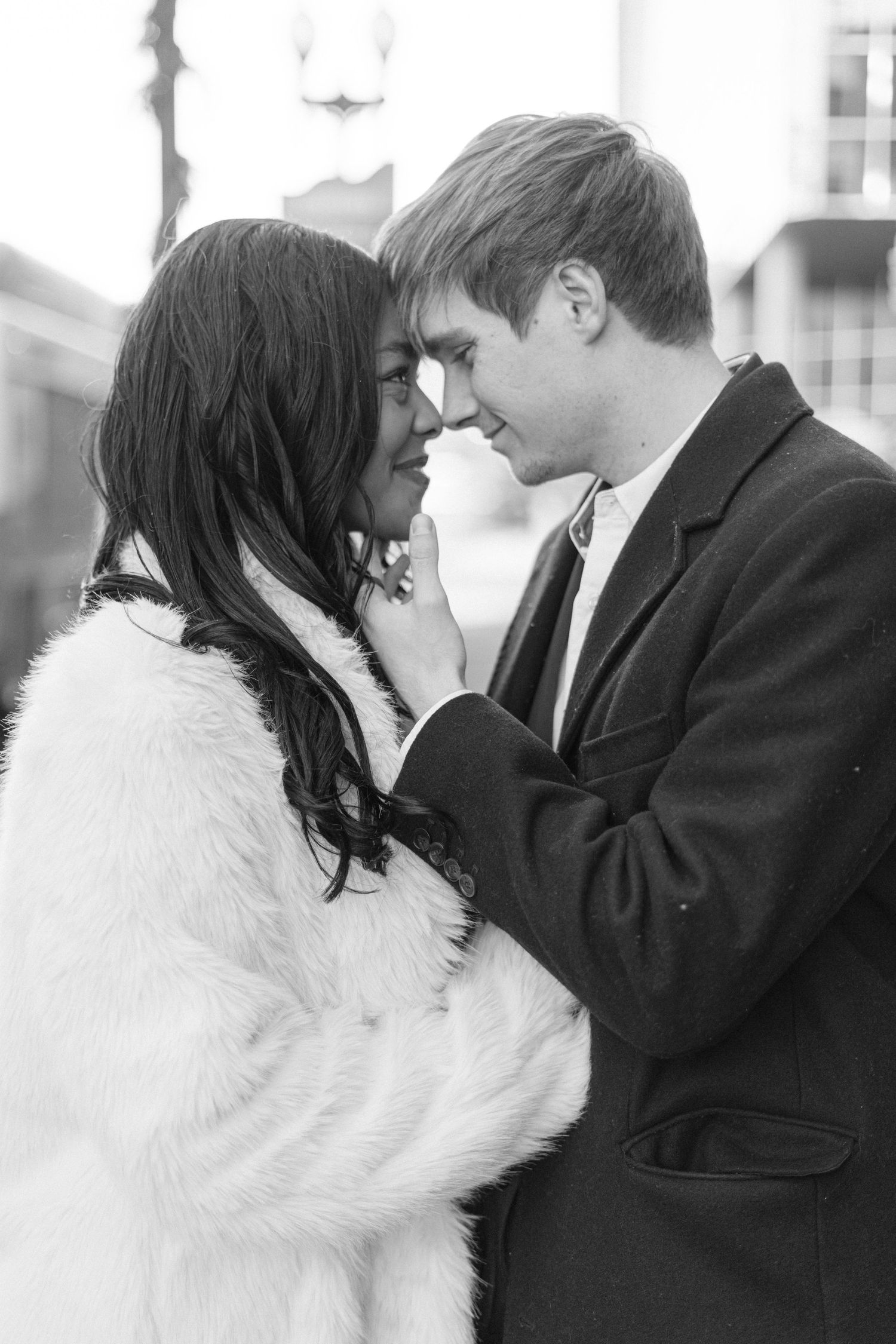 A romantic winter moment captured in black and white photography.