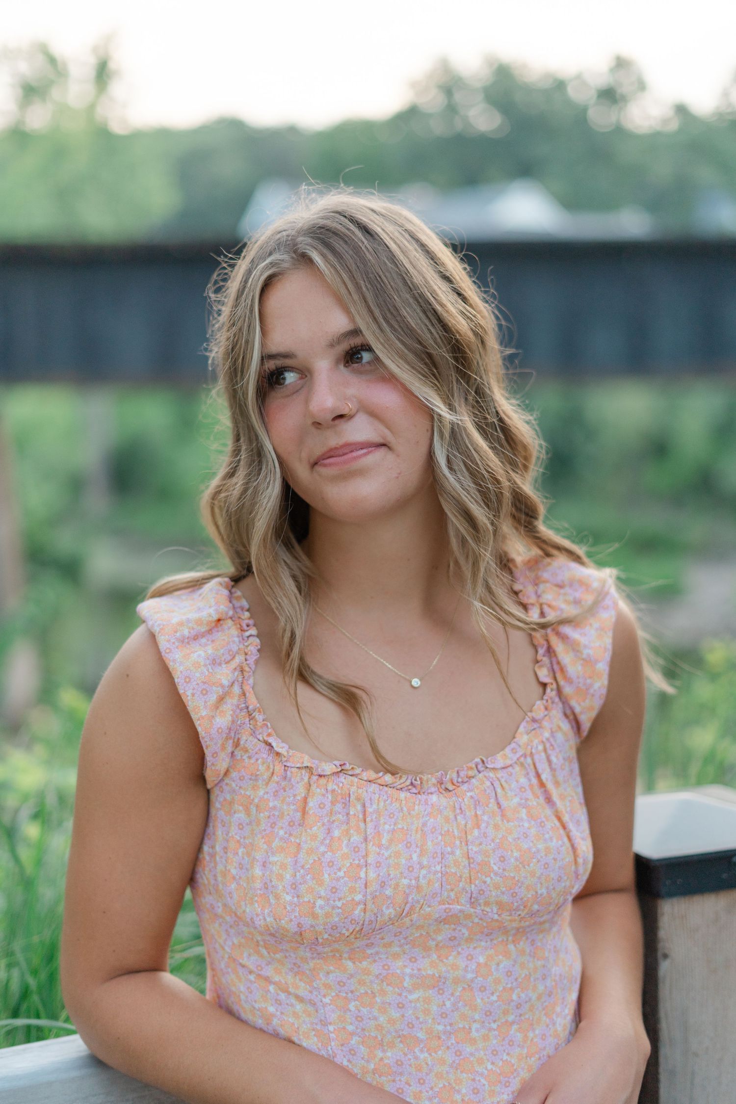 Summer portrait with soft lighting and natural styling on an outdoor deck.