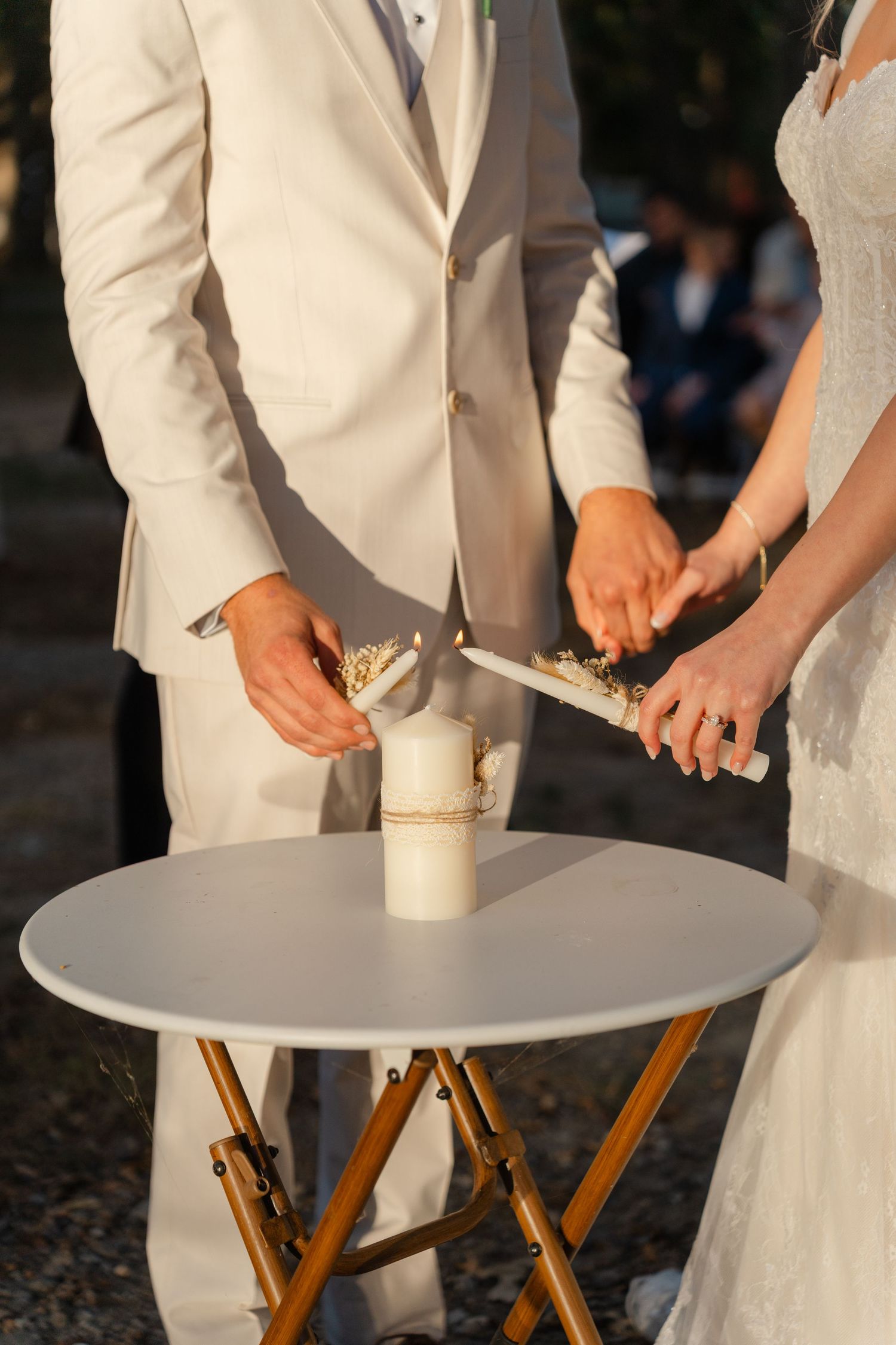 Wedding ceremony setup with cream-colored decor and wooden accents.