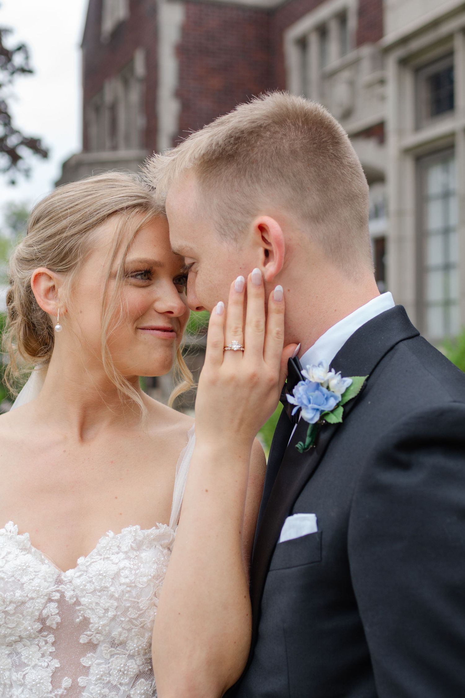 Intimate wedding couple shares tender moments in a romantic outdoor portrait series.