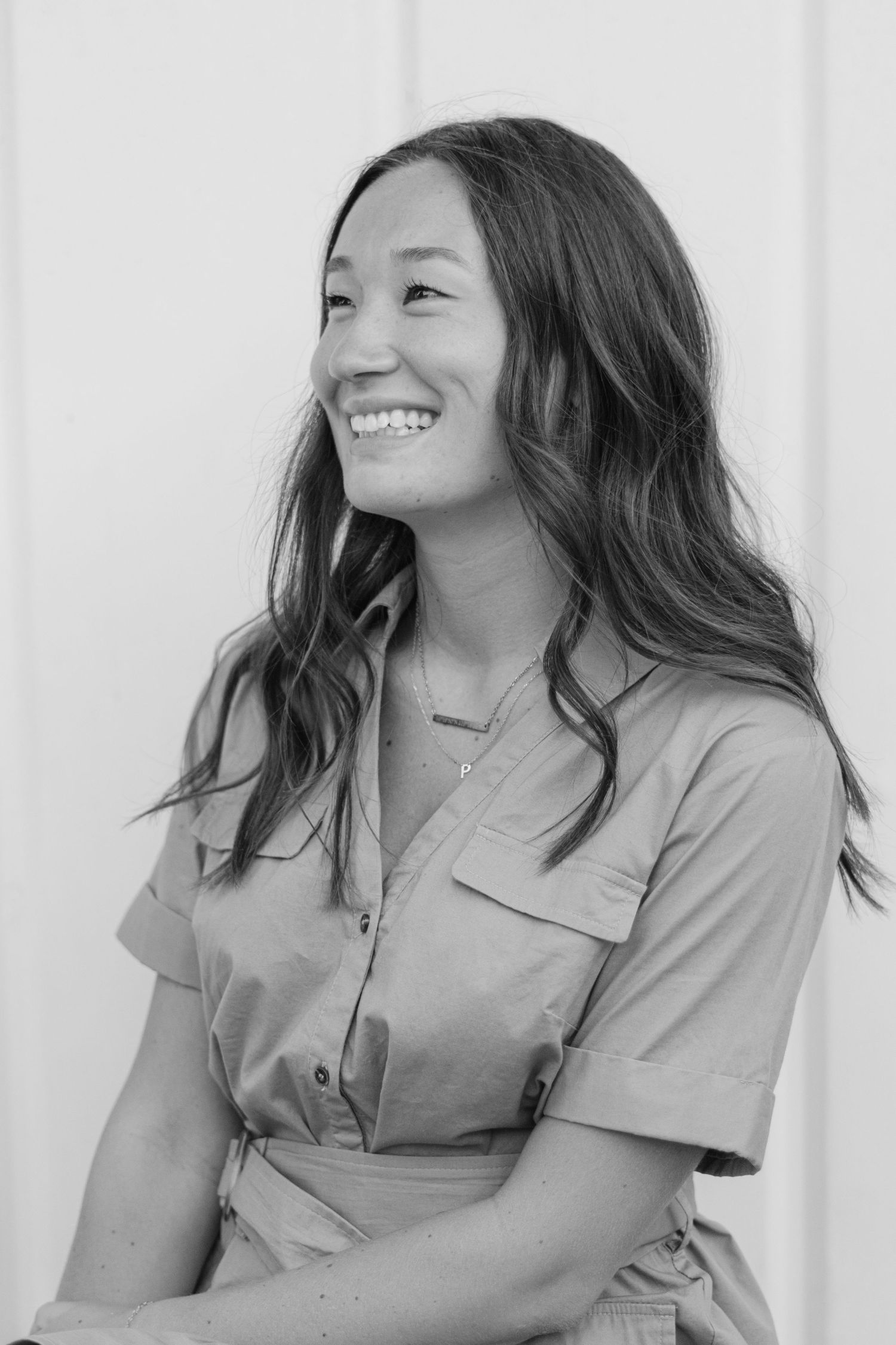 Black and white portrait series showing natural laughter and candid moments.