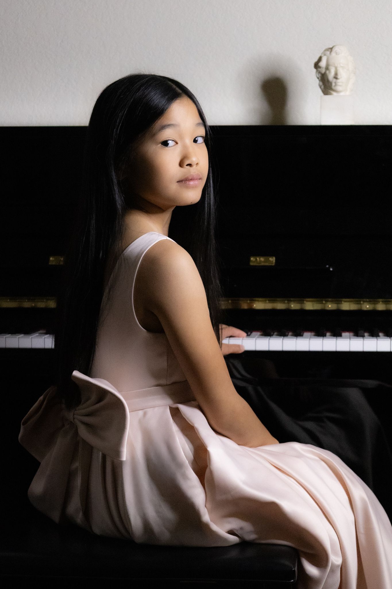 Young girl playing grand piano fine art children portrait session in Southlake TX