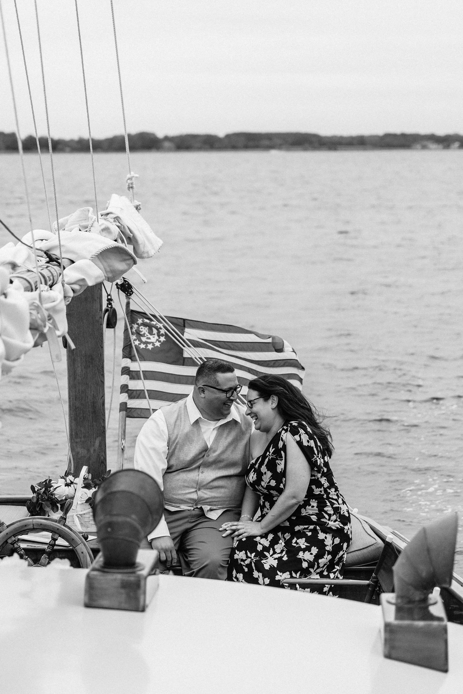 A vintage black and white photo sequence showing a couple relaxing together on a boat at sea.