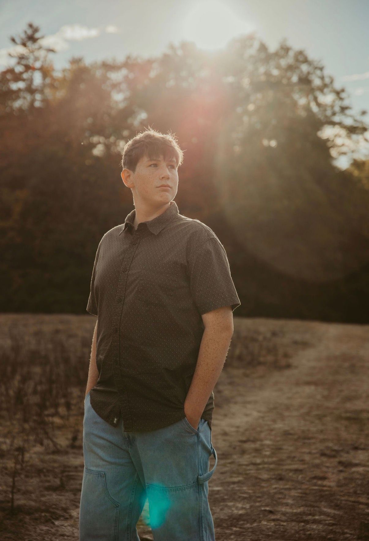 This is a picture of a boy looking away  from the camera