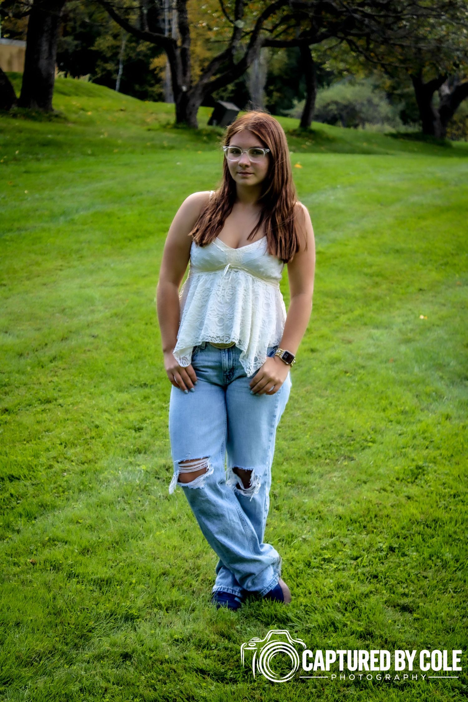 This is a picture of a girl standing in the field