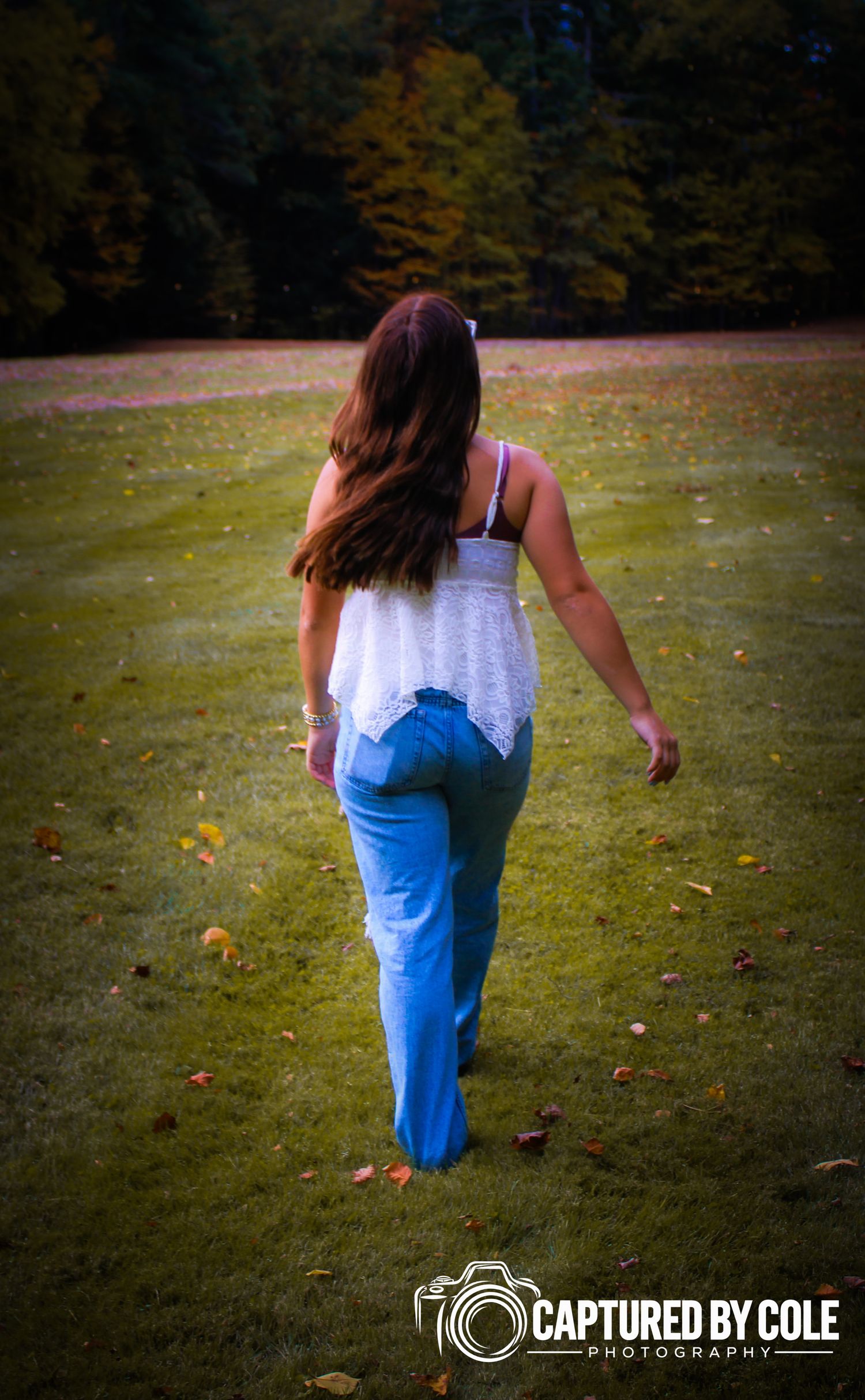 This is a picture of a girl walking away from the camera