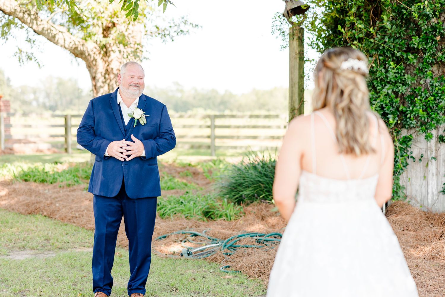 First look wedding photography sequence showing anticipation in a lush garden setting.