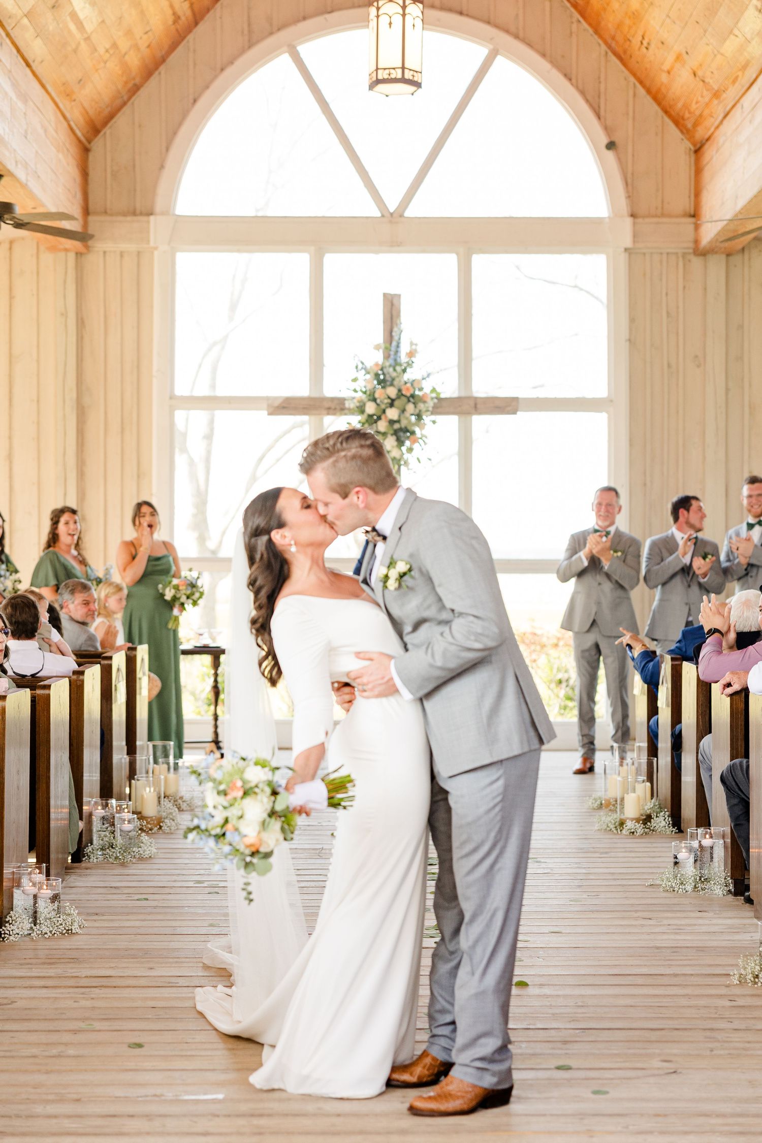 First dance sequence in a rustic chapel with natural lighting and wooden floors.