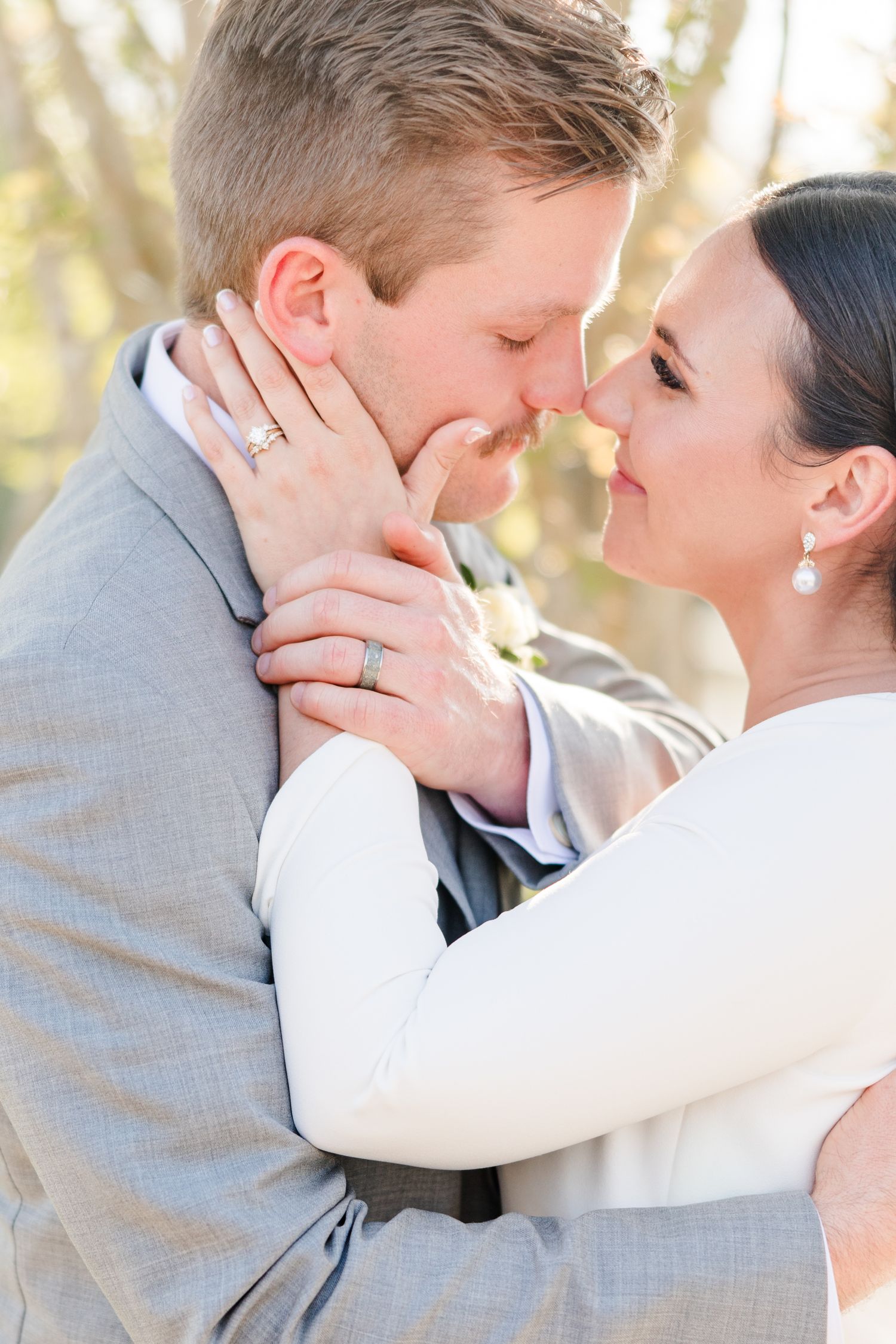 Intimate wedding moment captured in soft natural light.