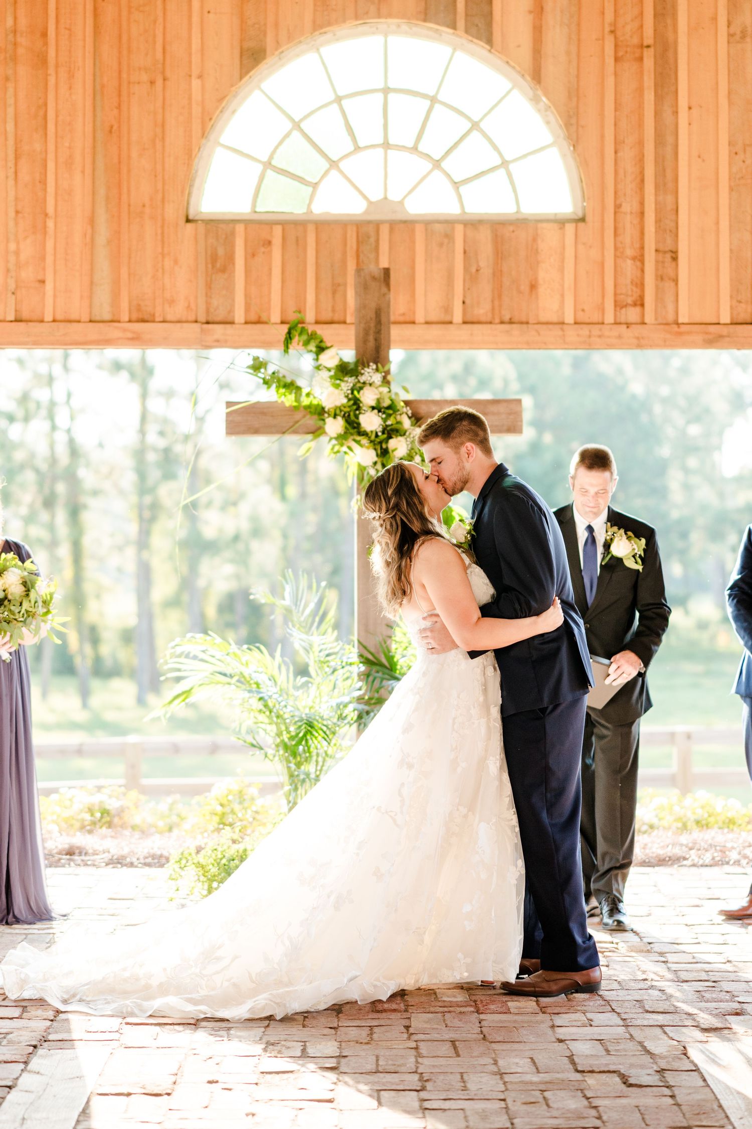 A wedding ceremony sequence captured in a sunlit barn venue.