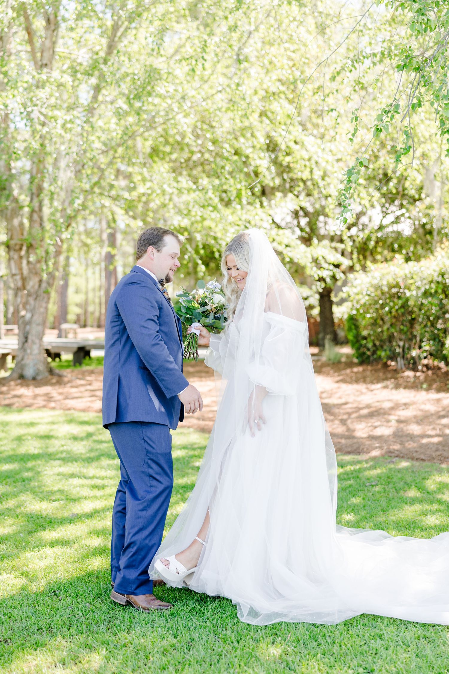 First look wedding moment captured in a serene garden with natural lighting.