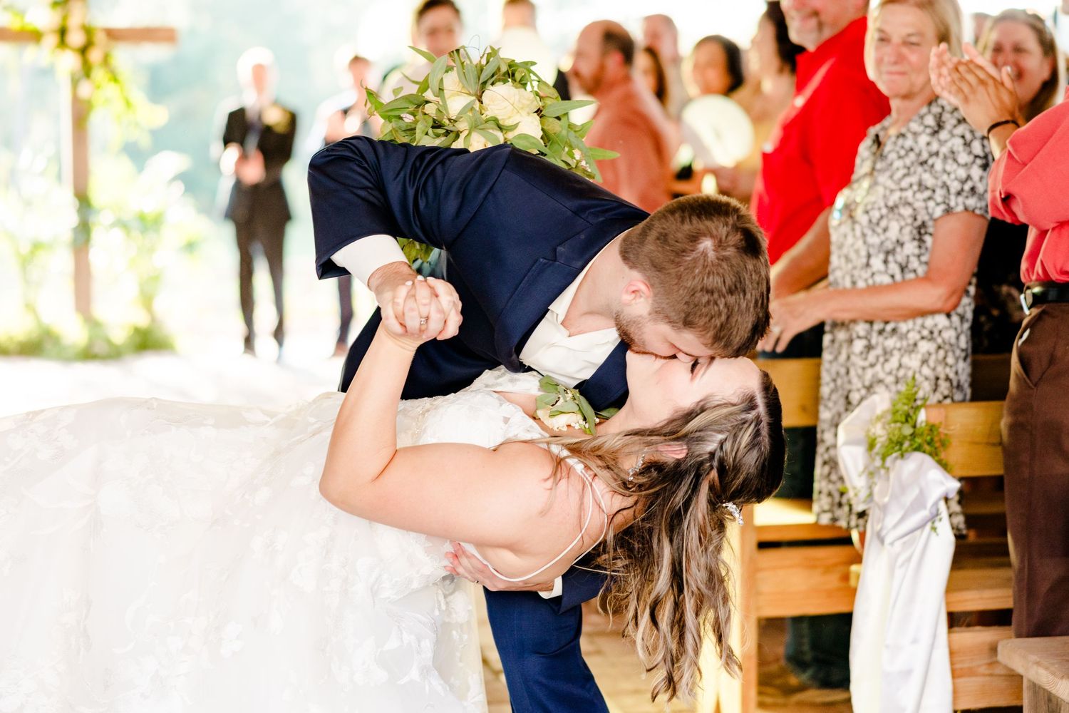 Wedding celebration moments captured in a rustic barn setting with natural light.