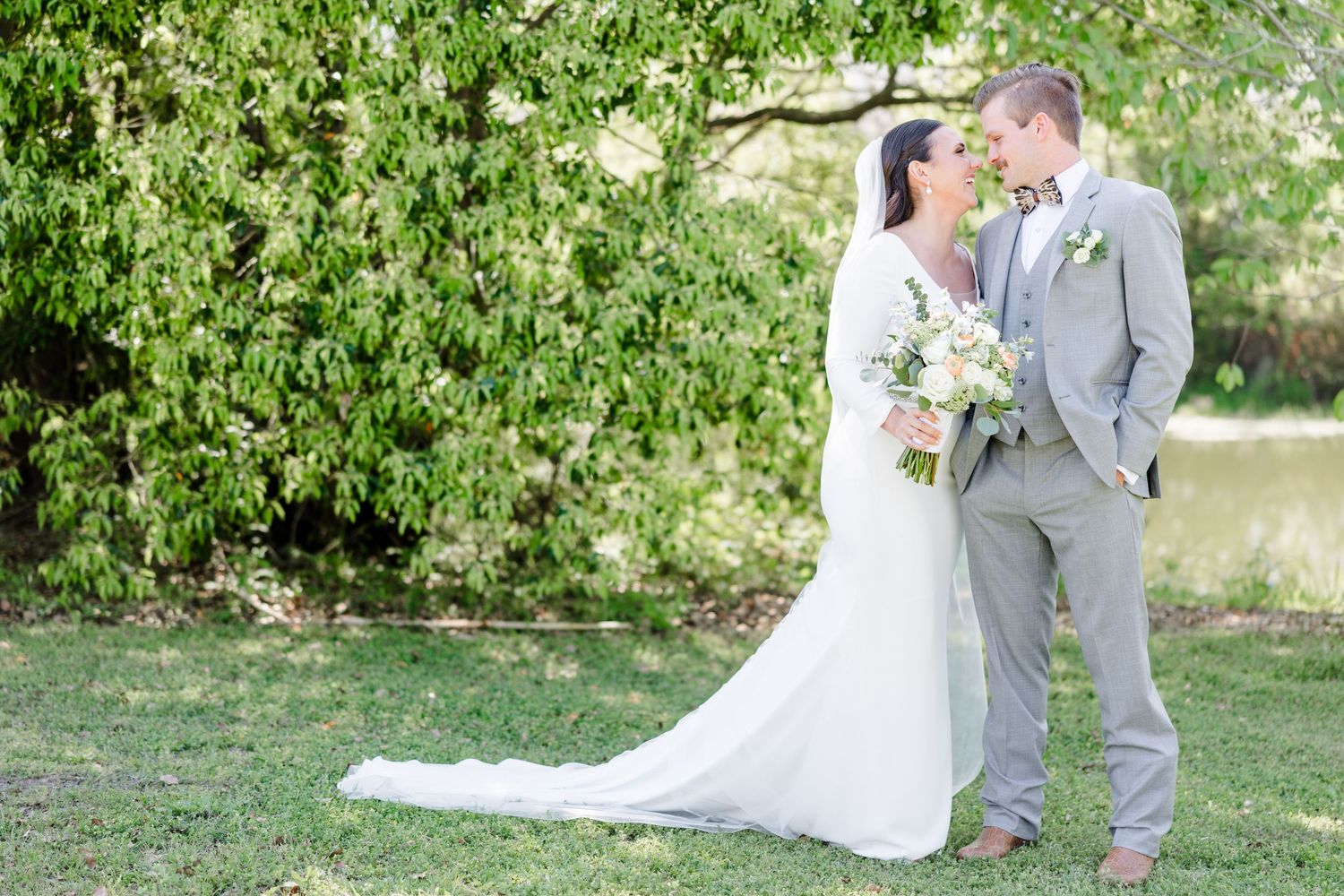 Romantic wedding photos in garden setting with lush green background.