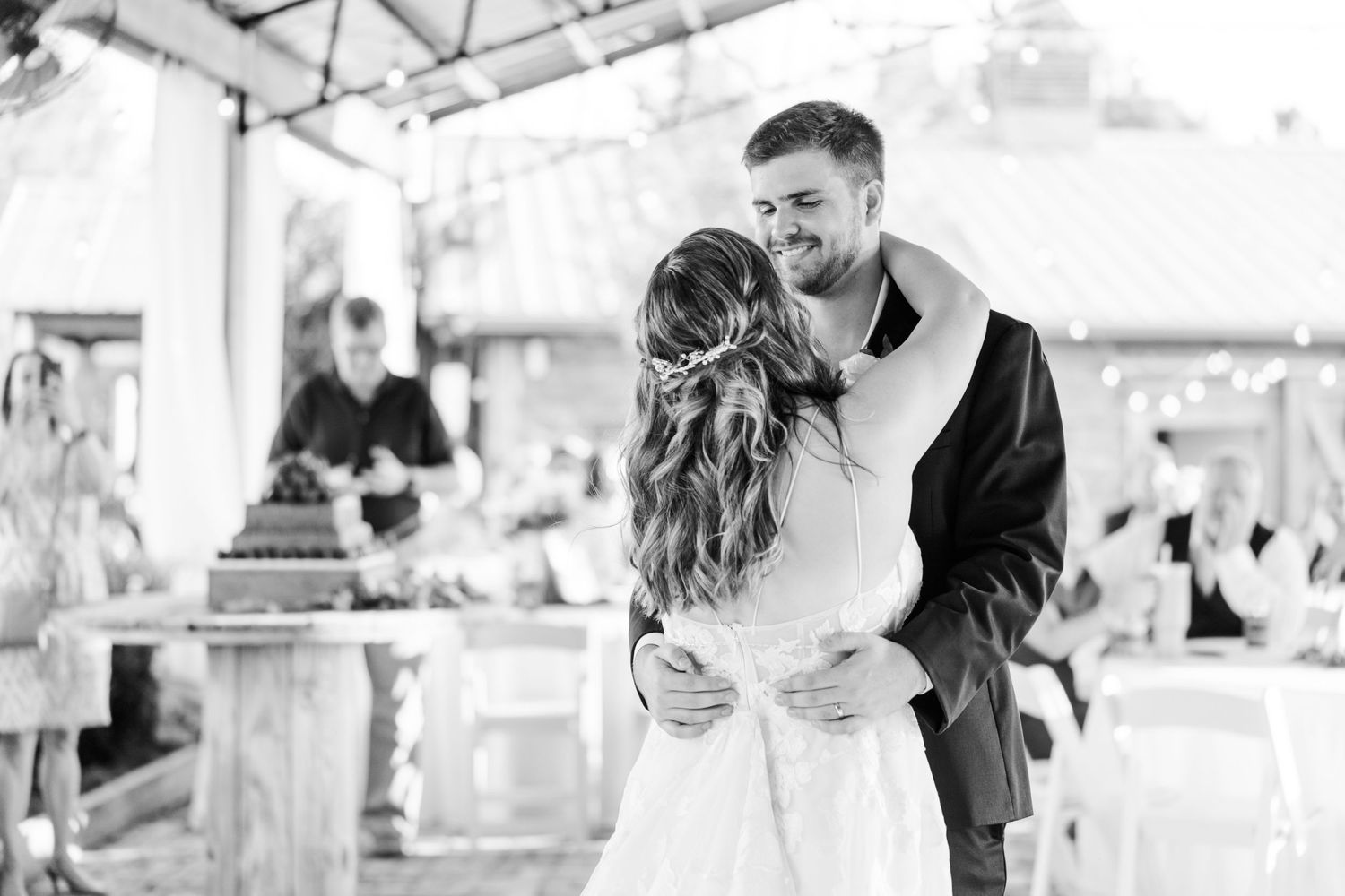Black and white photographs of wedding reception moments under covered venue.