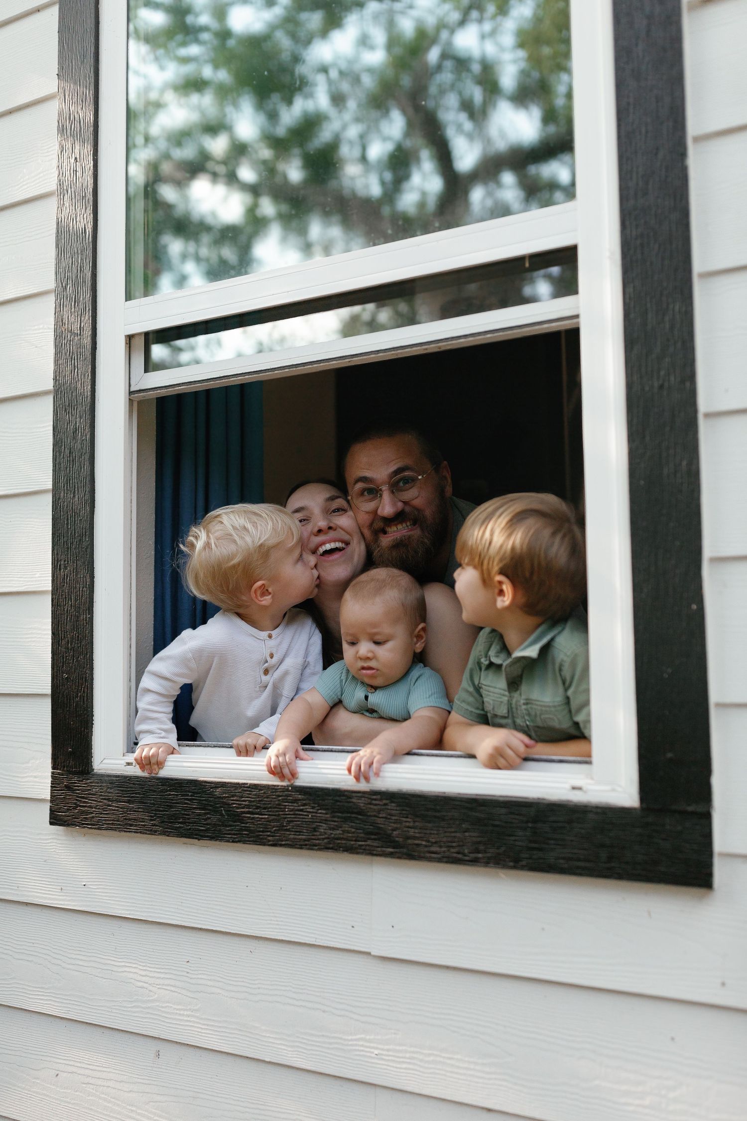 Family photography session at their Sarasota, Florida home — capturing candid, cozy, and warm moments in the comfort of their own space.