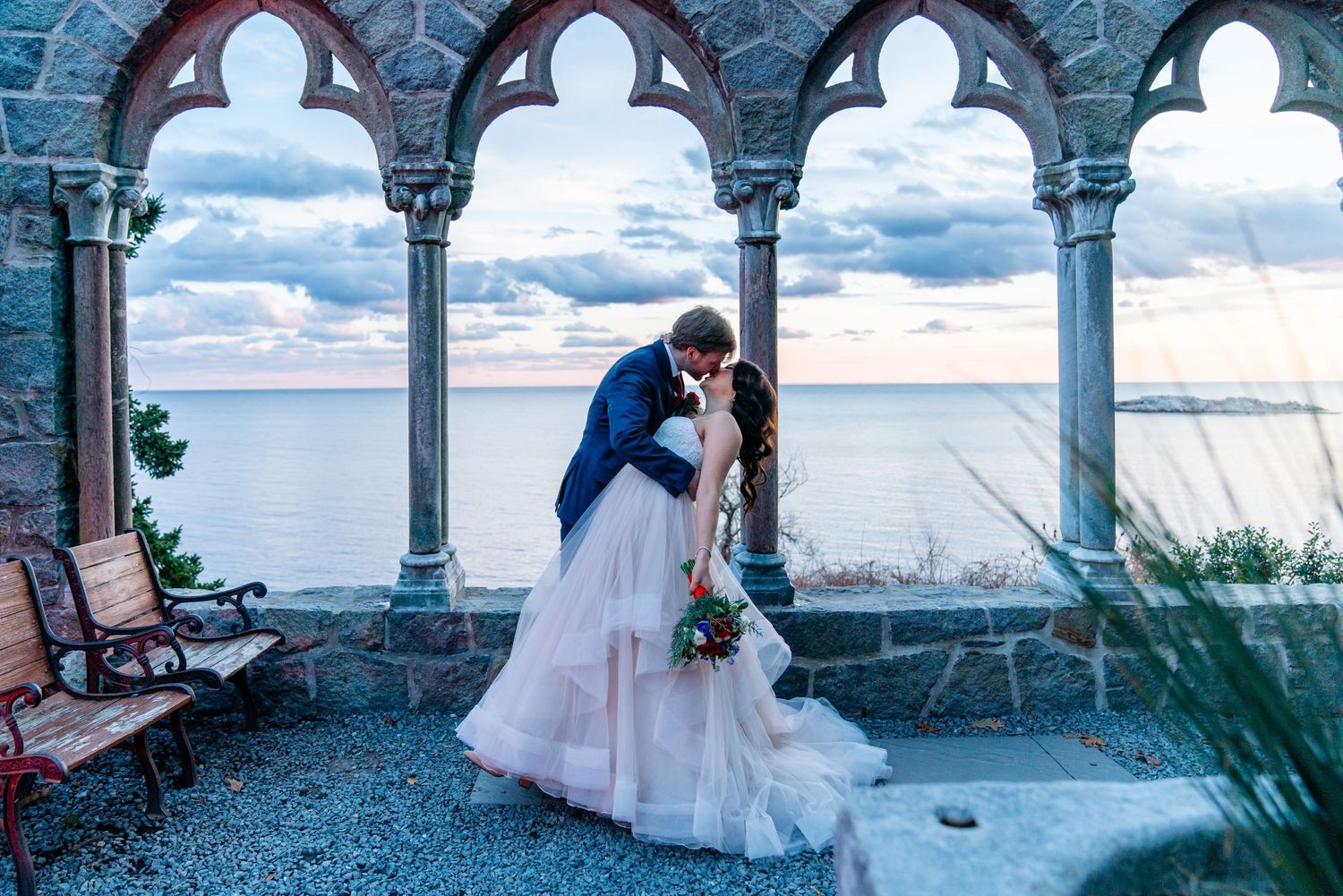 Romantic wedding portrait under stone archways overlooking ocean view. Hammond Castle Elopement- Gloucester, MA.