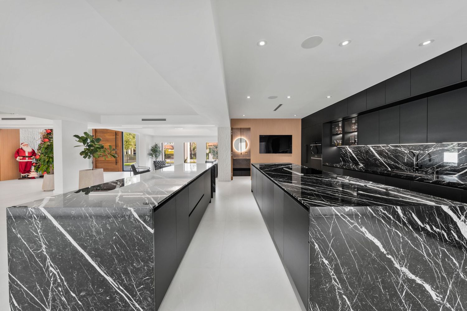 Modern office reception area with sleek black marble counters and minimalist interior design features.
