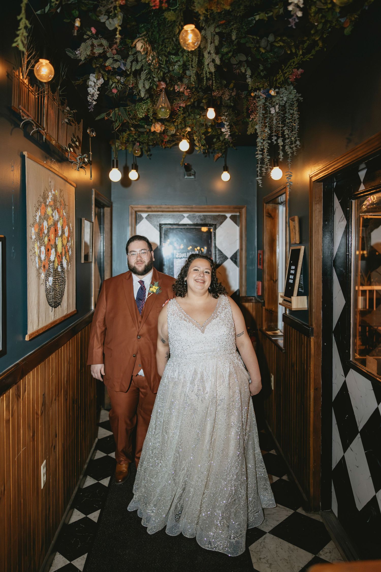 A sequence of photos showing a person in a white lace dress walking through a dimly lit hallway with wood paneling.
