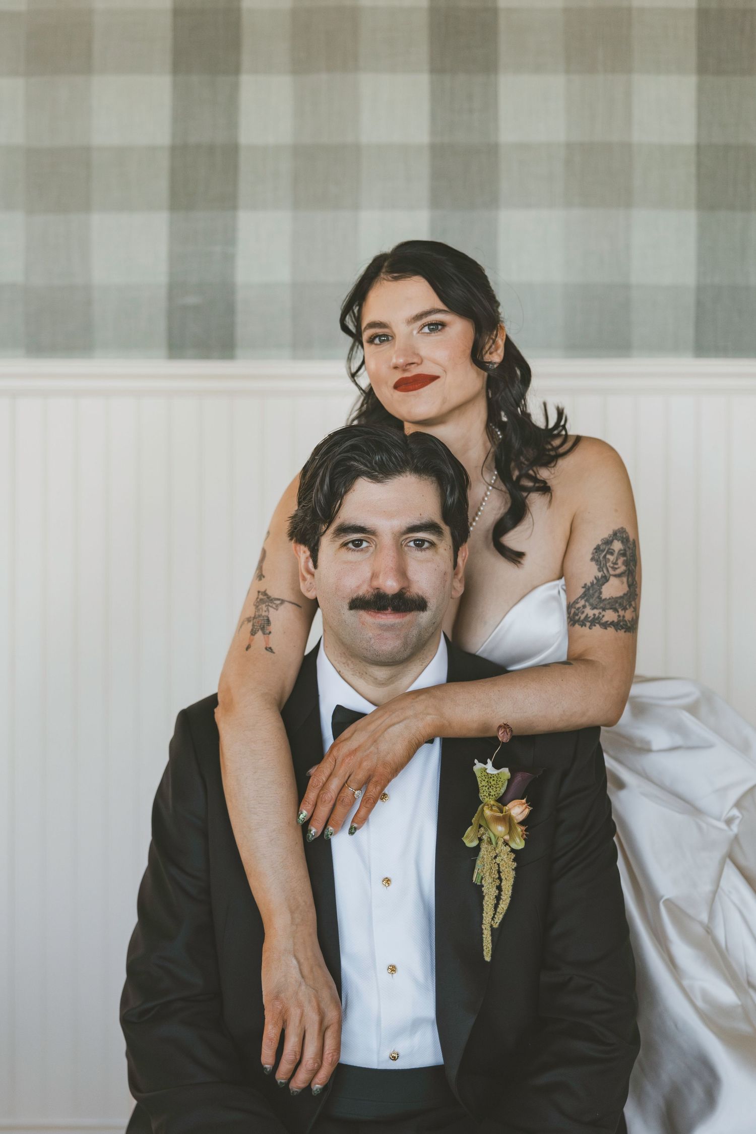 Wedding couple in black and white formal attire pose together in a series of intimate portrait photos.