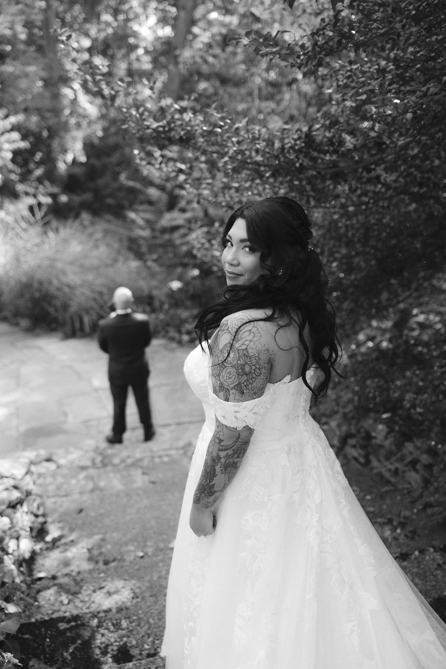A series of black and white photos showing a person in a flowing white wedding dress walking through a garden setting.