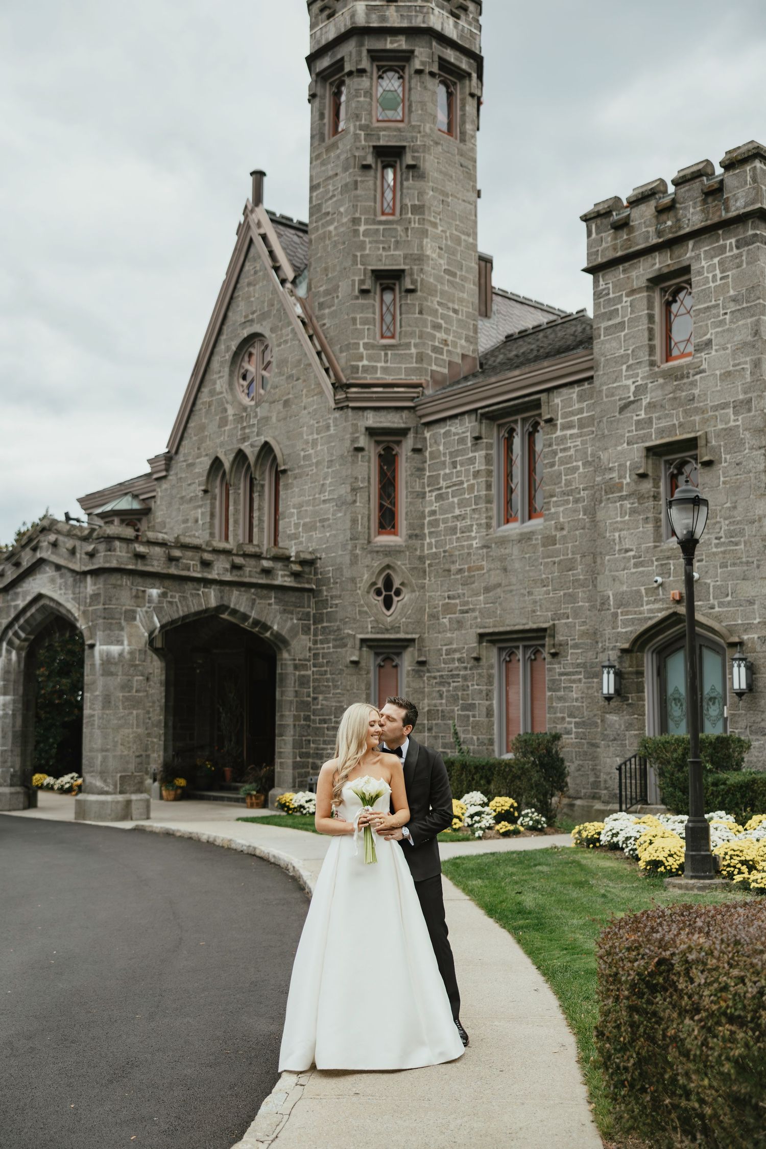 A series of five wedding photos showcasing a stone Gothic church exterior with a couple in formal attire.