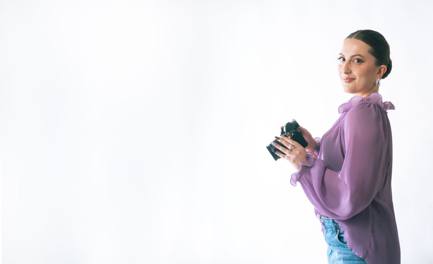 A sequence of four photos showing someone in a purple sweater holding and examining a blue coffee mug.