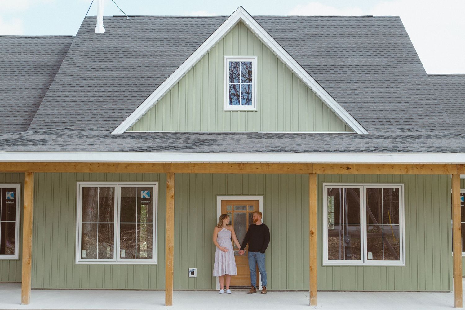 An in-home maternity photo session at their newly constructed home in early spring.