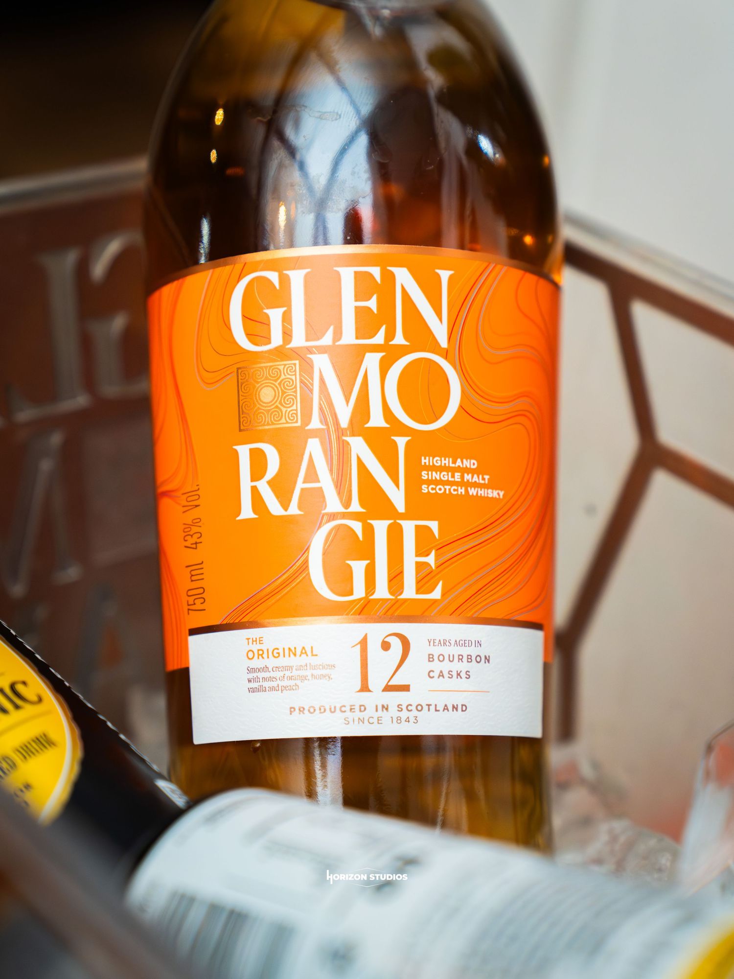 Glenmorangie 12-year-old Original Highland Single Malt Scotch Whisky in Bourbon Casks, 750ml bottle with orange label.