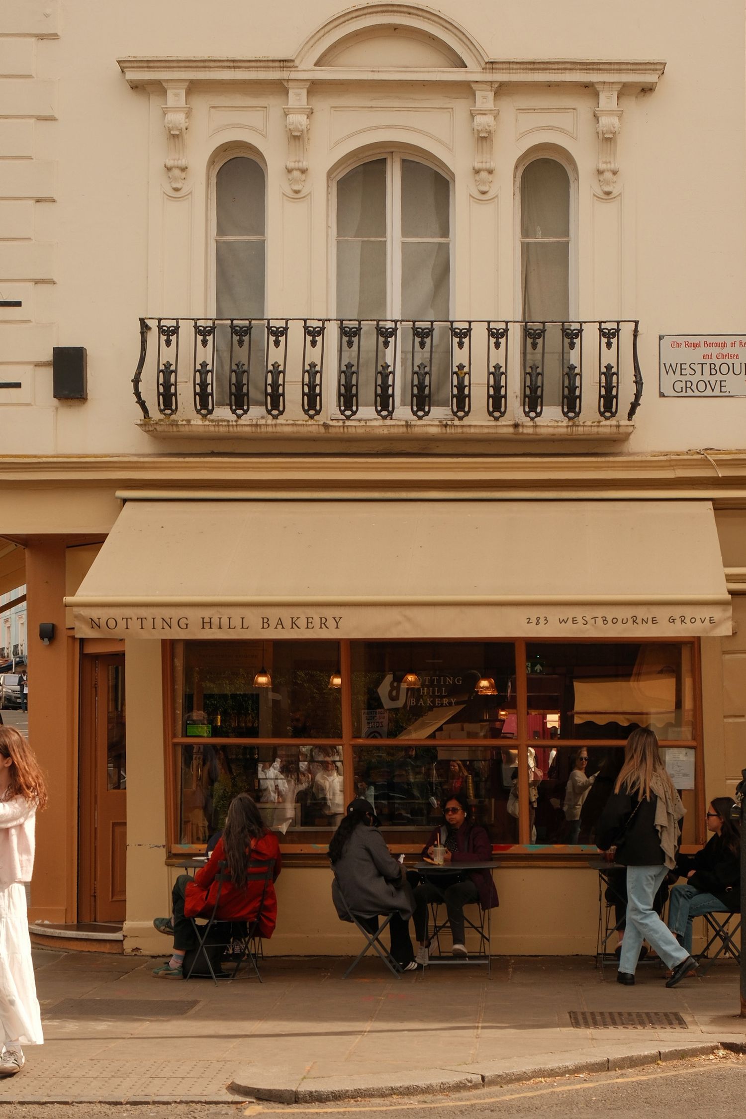 Warm exterior of artisan bakery in Notting Hill London, Notting Hill Bakery