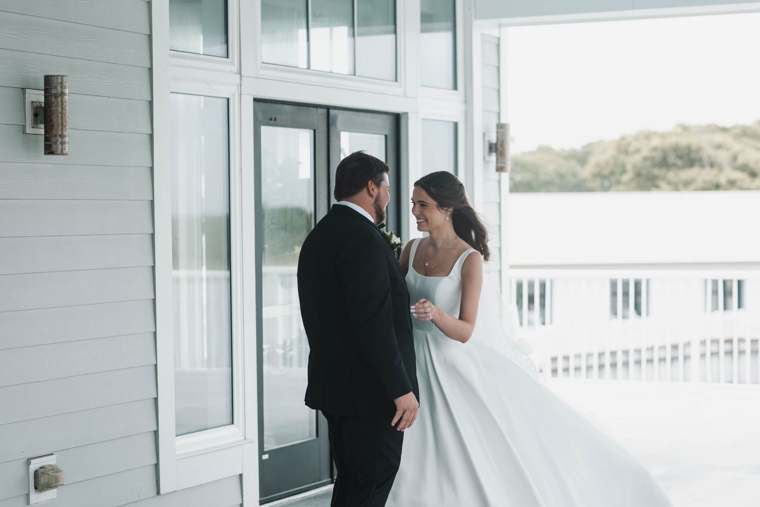 Bride and Groom embrace after first look at The Beaufort Hotel in Beaufort, North Carolina