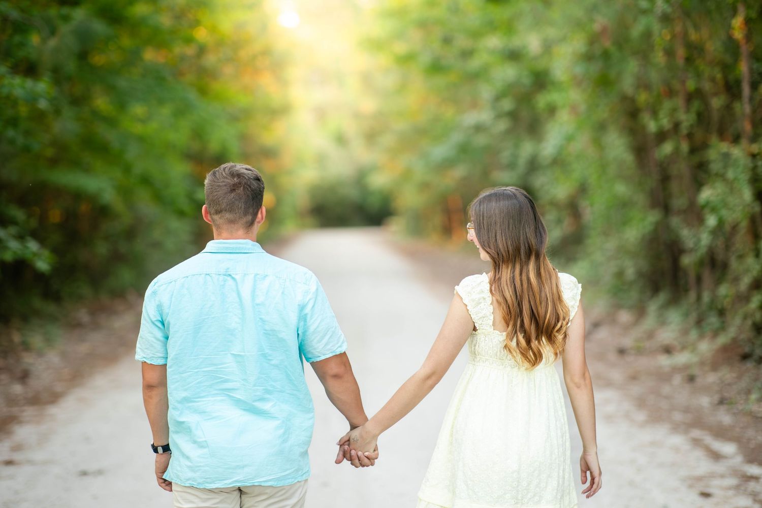 Couple holding hands in golden hour photo session in Wilson North Carolina