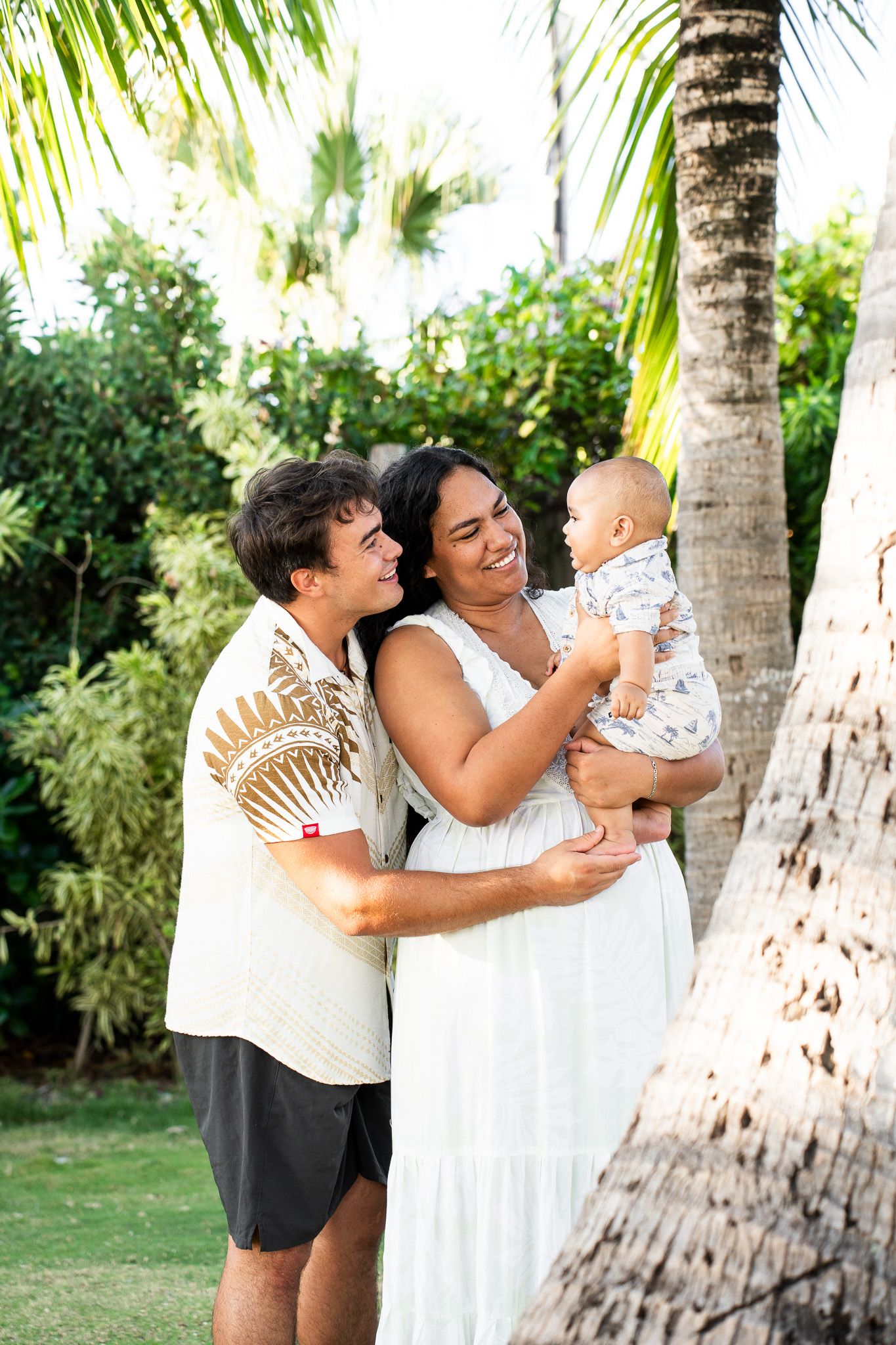Parents with their baby during a tropical family photography session in Bora Bora