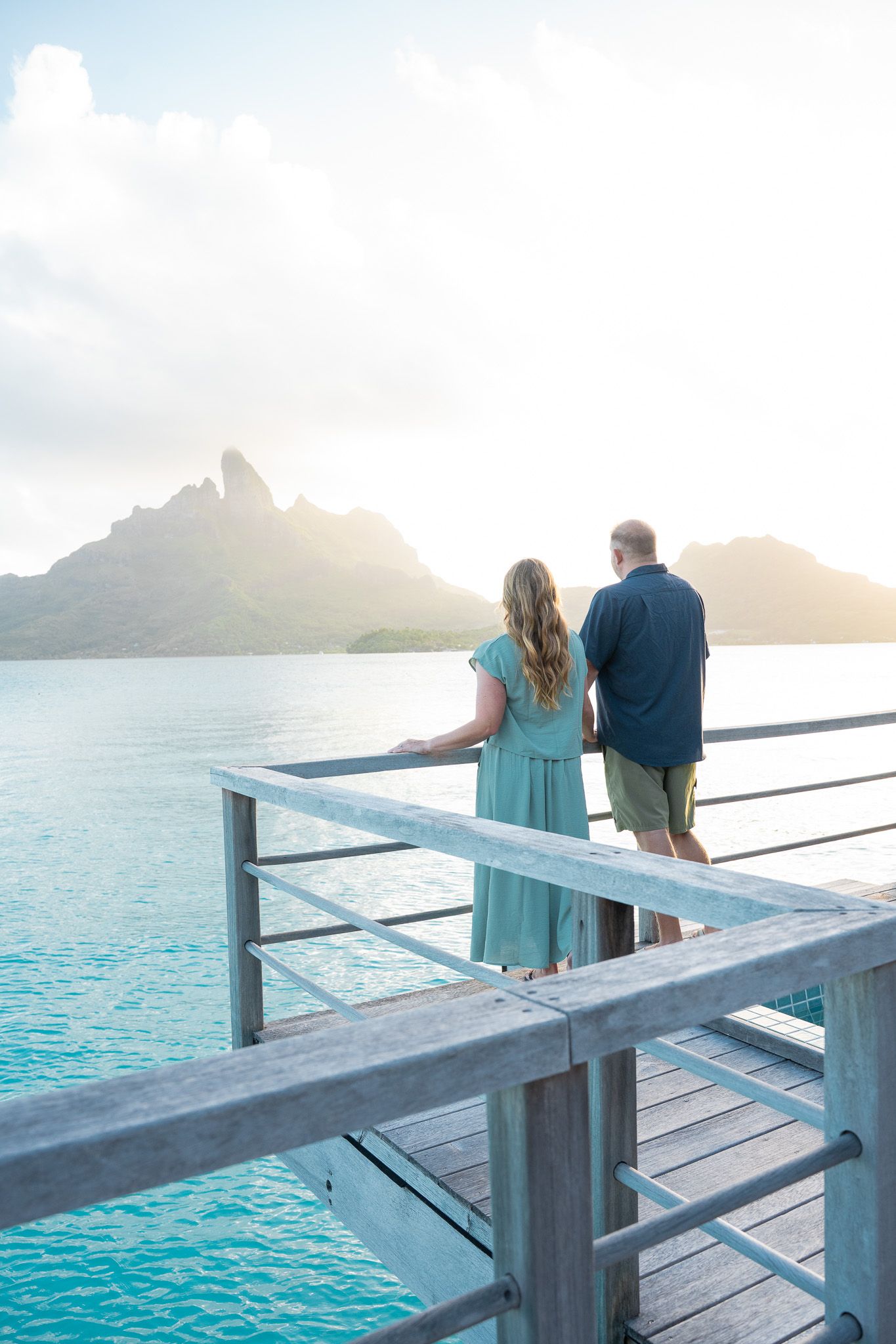 Couple overlooking the Bora Bora lagoon and Mount Otemanu during a romantic photoshoot