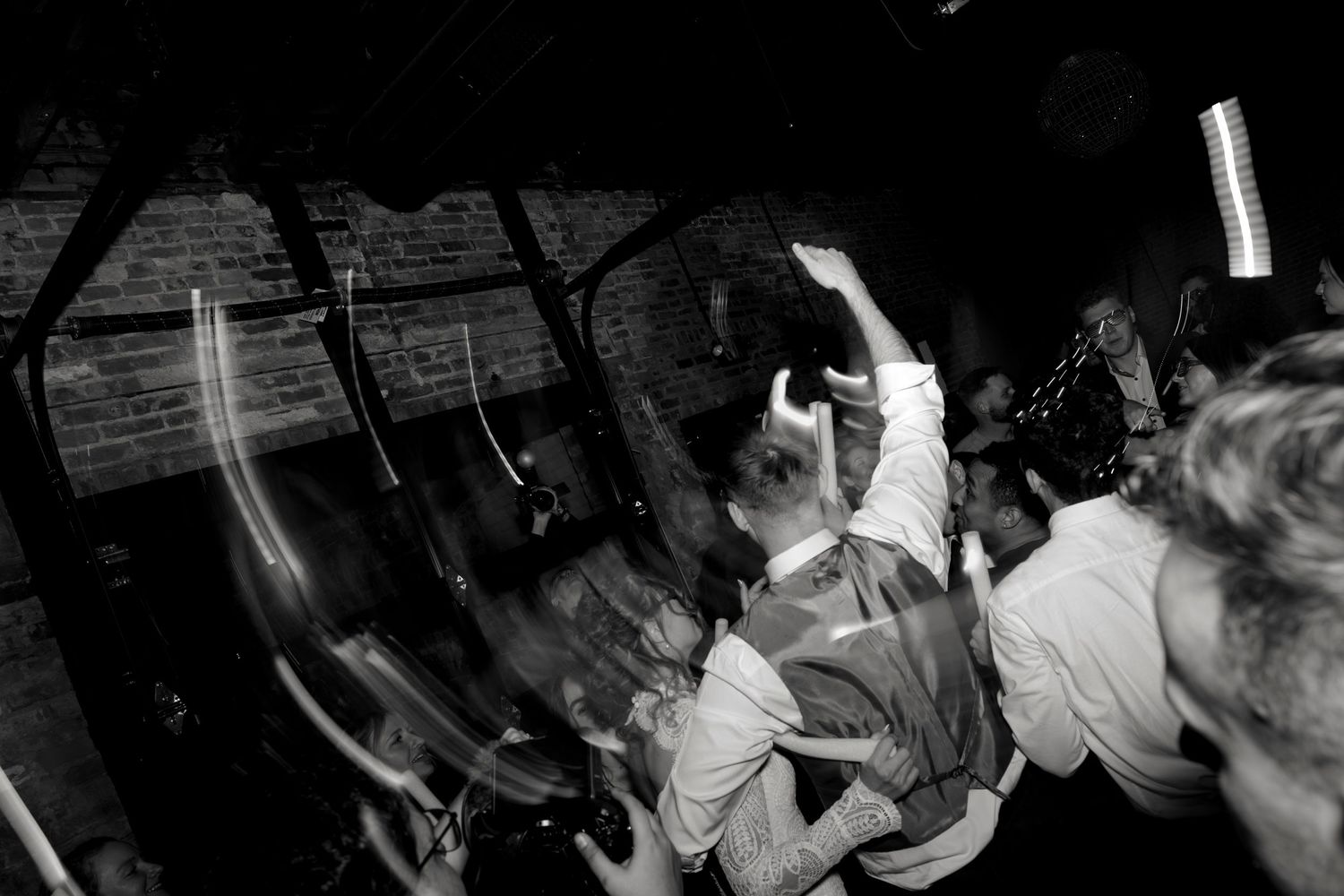 black and white photo of a dance floor with shutter drag
