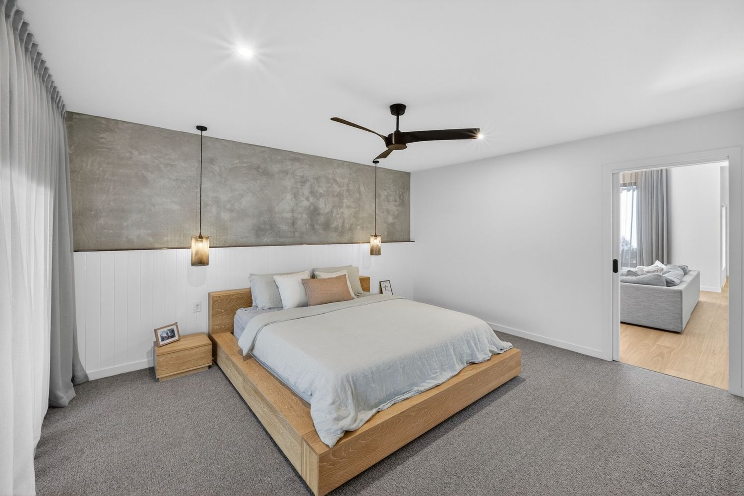 Master bedroom featuring a calm, modern interior with soft natural light, layered textures, and a relaxed, restful atmosphere.