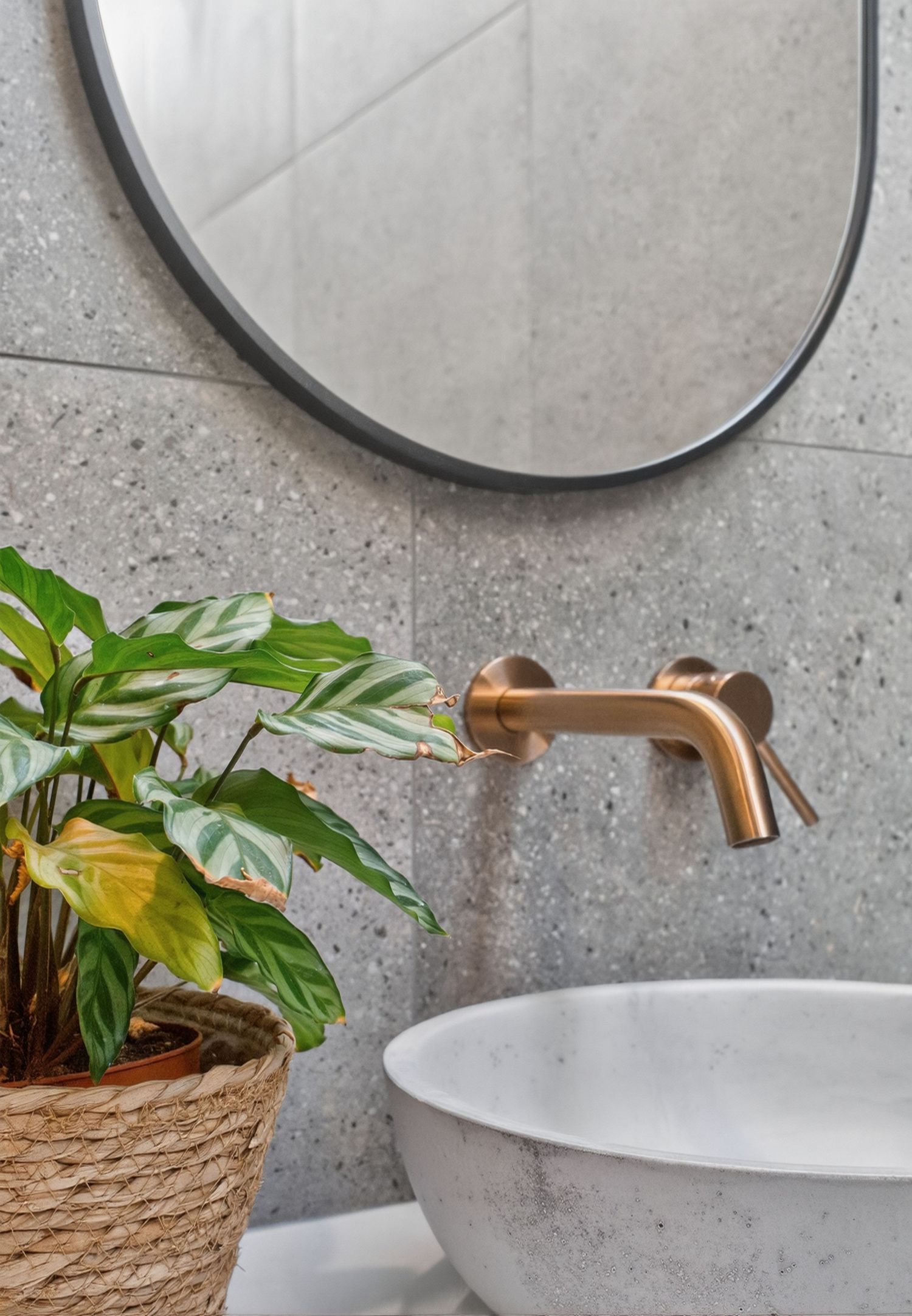 Feature design shot of a tap and mirror, highlighting bathroom fixtures, reflective surfaces, and considered interior styling