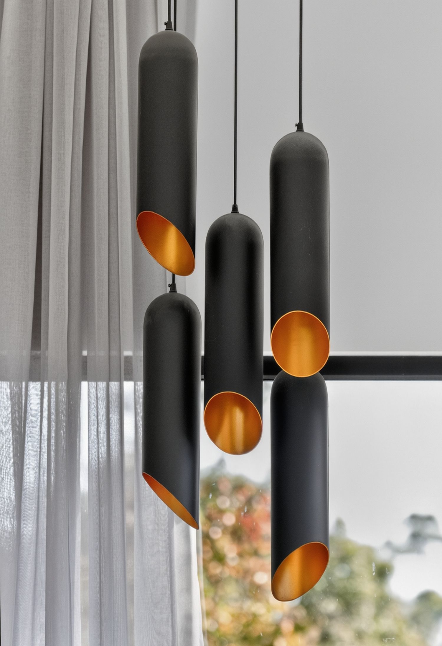 Interior detail image featuring a statement light fixture, highlighting design, form, and ambient lighting as a focal point within the space