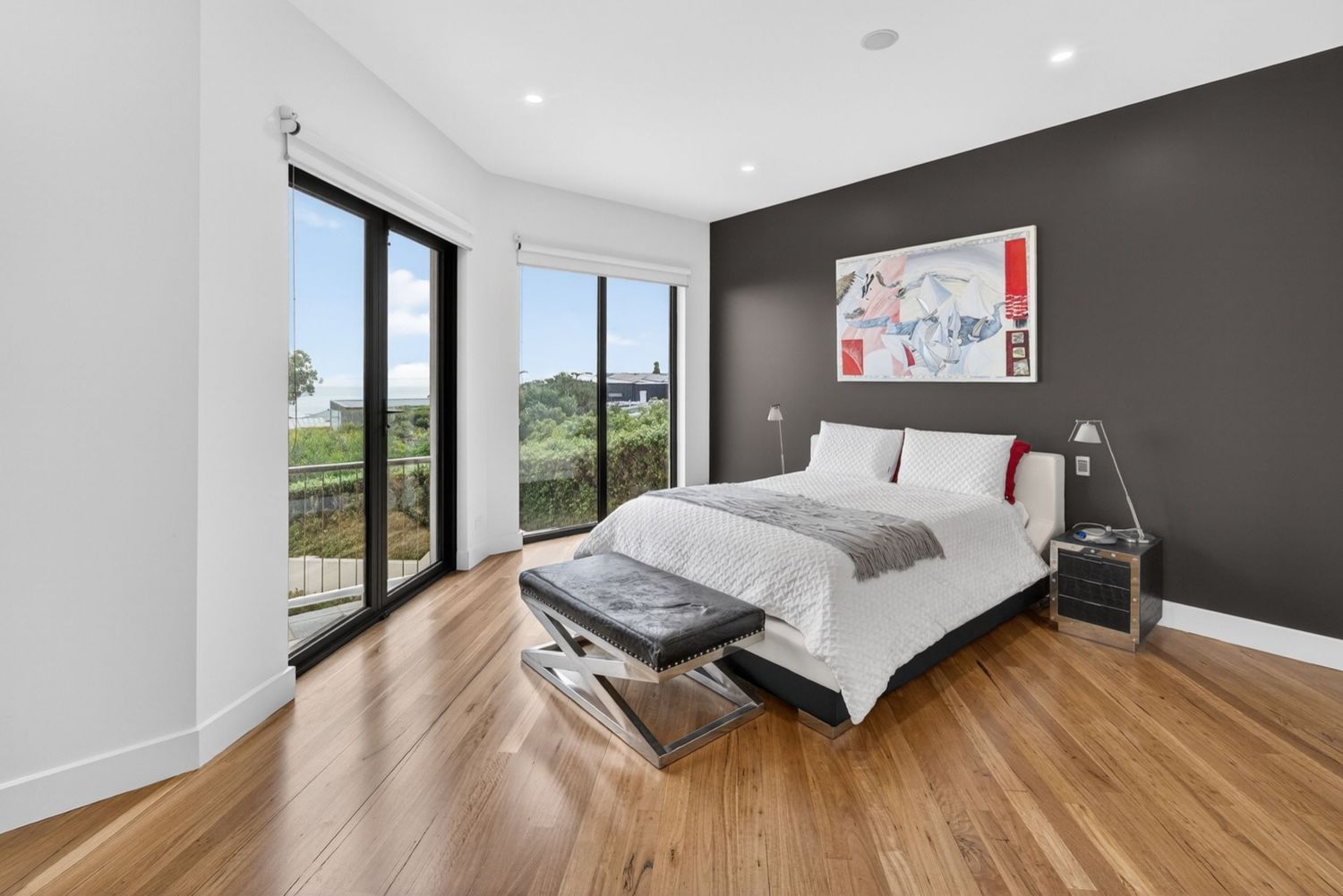 Master bedroom featuring a calm, modern interior with soft natural light, layered textures, and a relaxed, restful atmosphere.