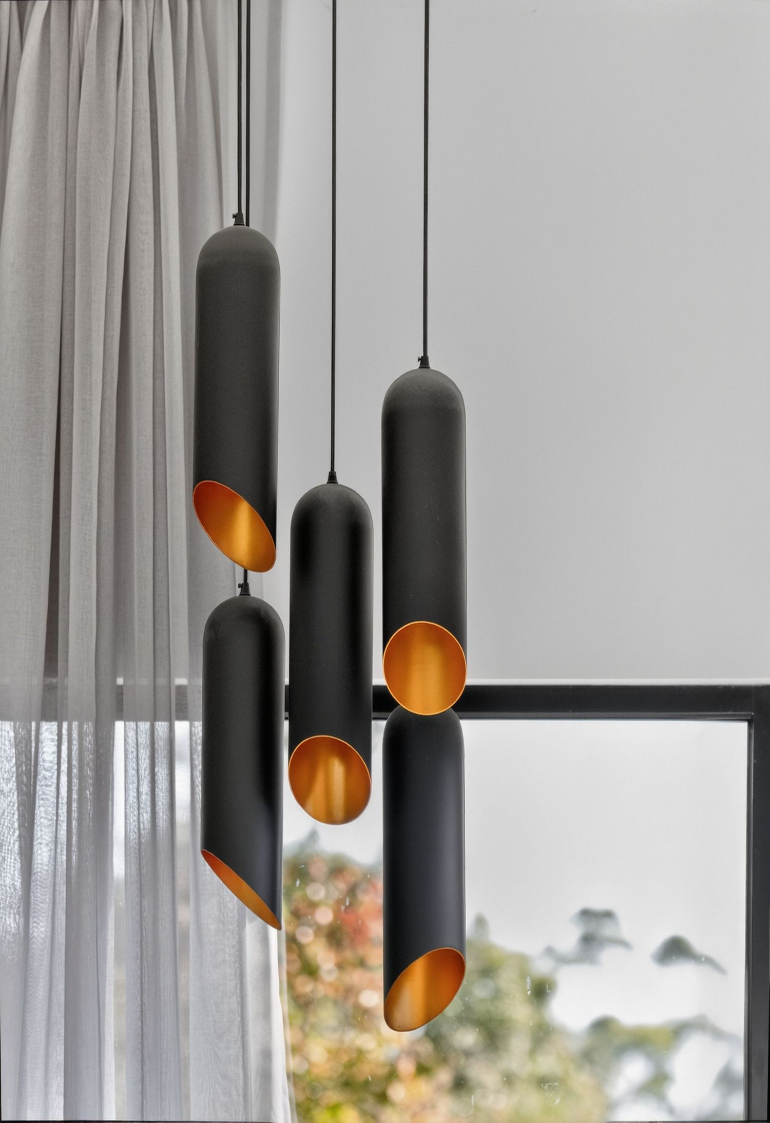 Interior detail image featuring a statement light fixture, highlighting design, form, and ambient lighting as a focal point within the space